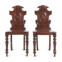 A Pair of Regency Style Oak Hall Chairs