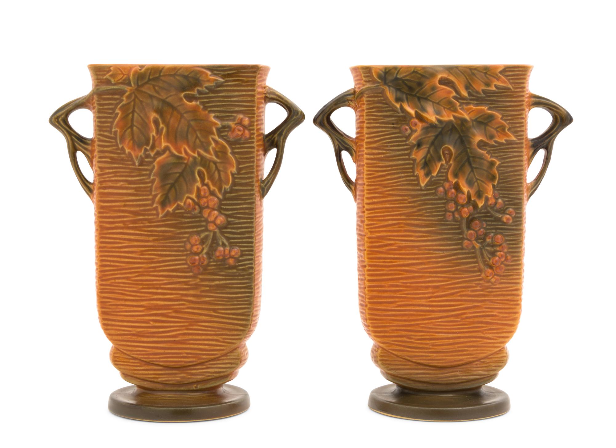 A Pair of Roseville Bushberry Pottery Vases Height 9 1/4 inches.