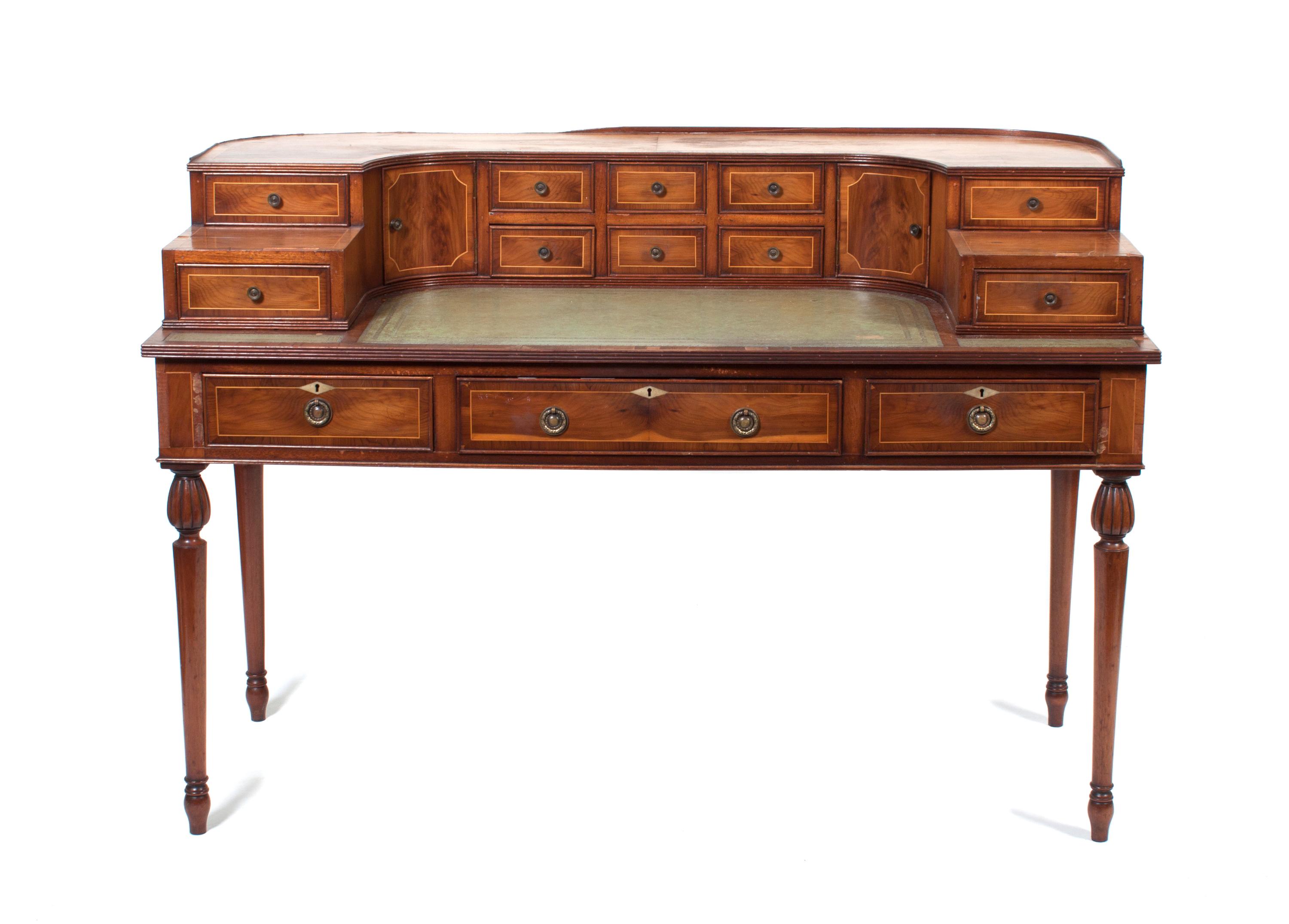A Yew Wood Carlton House Desk Height 37 1/2 x width 54 1/2 x depth 27 1/2 inches. — CIRCA 1870