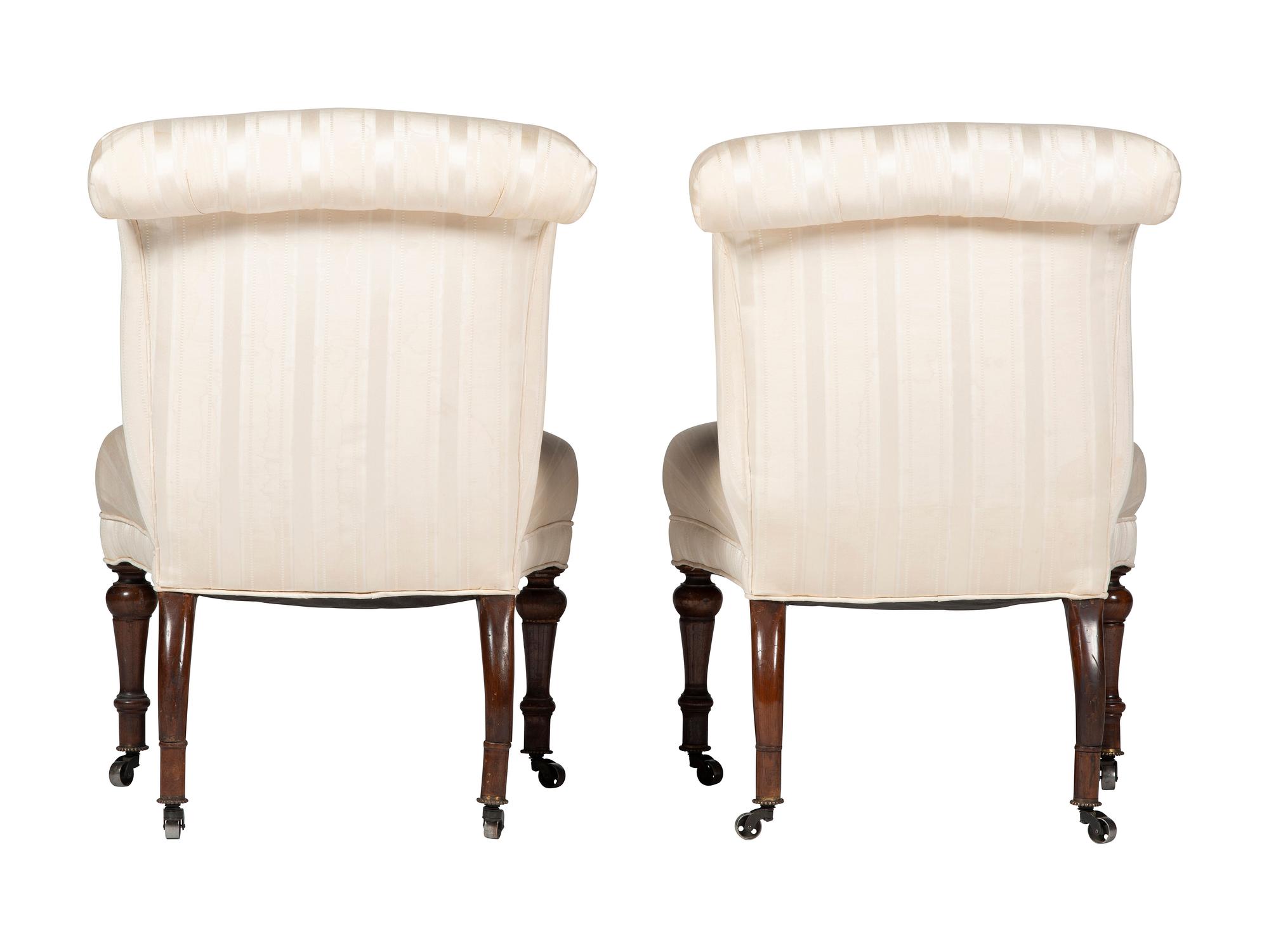A Pair of Victorian Mahogany Roll Back Slipper Chairs