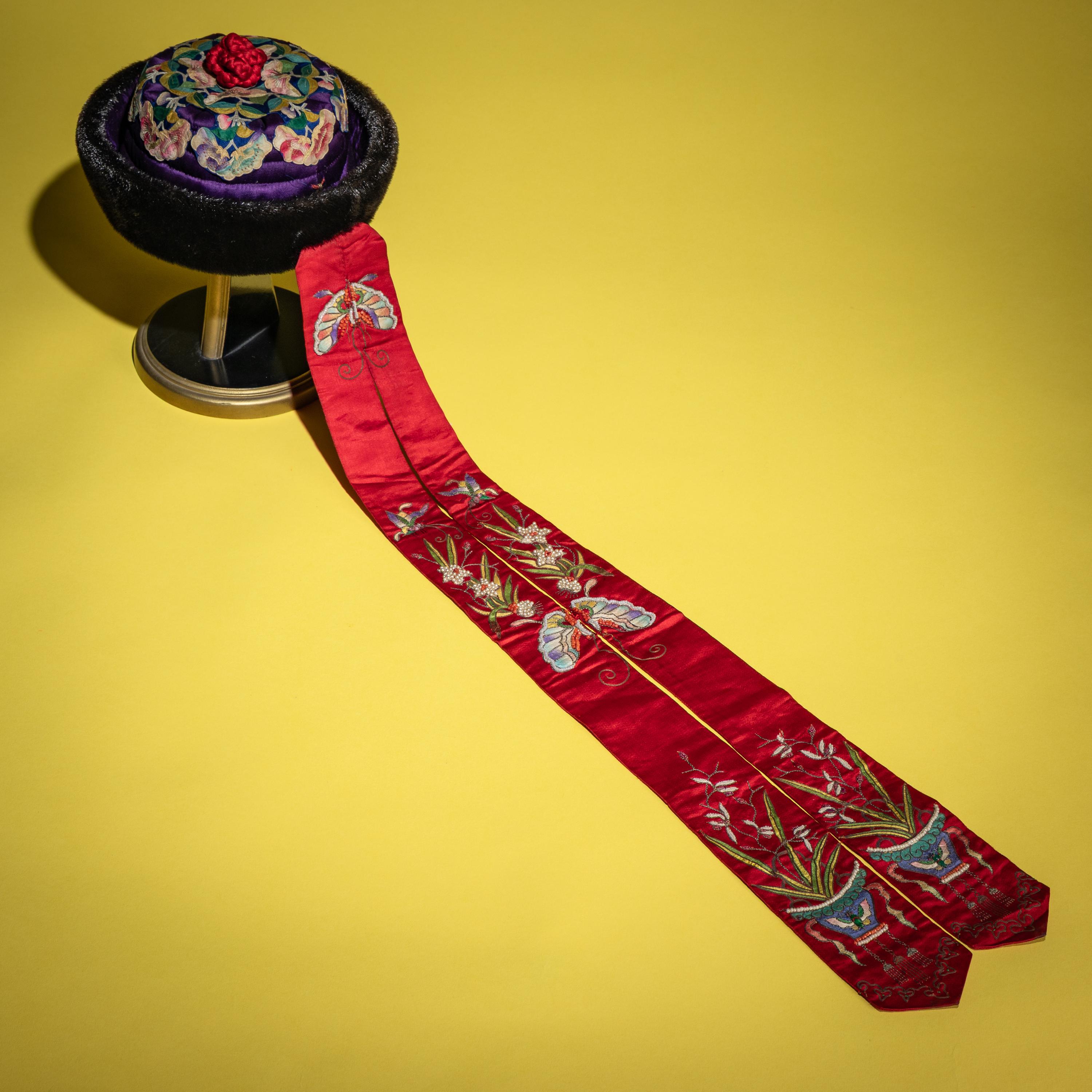 An Embroidered Silk Manchu Noblewoman's Winter Hat, Kunqiumao , 19th Century — 清晚期 紫頂蓋花鑲珠后妃坤秋帽