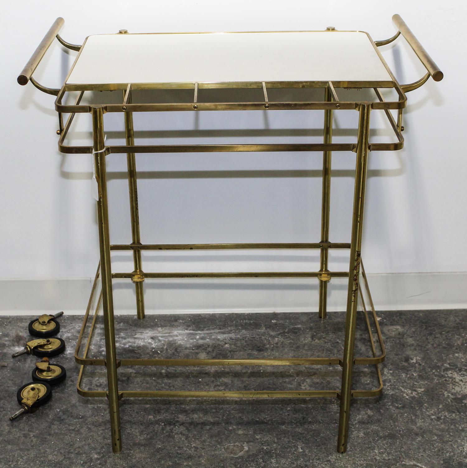 An Italian Brass and Glass Bar Cart. Height 34 inches.