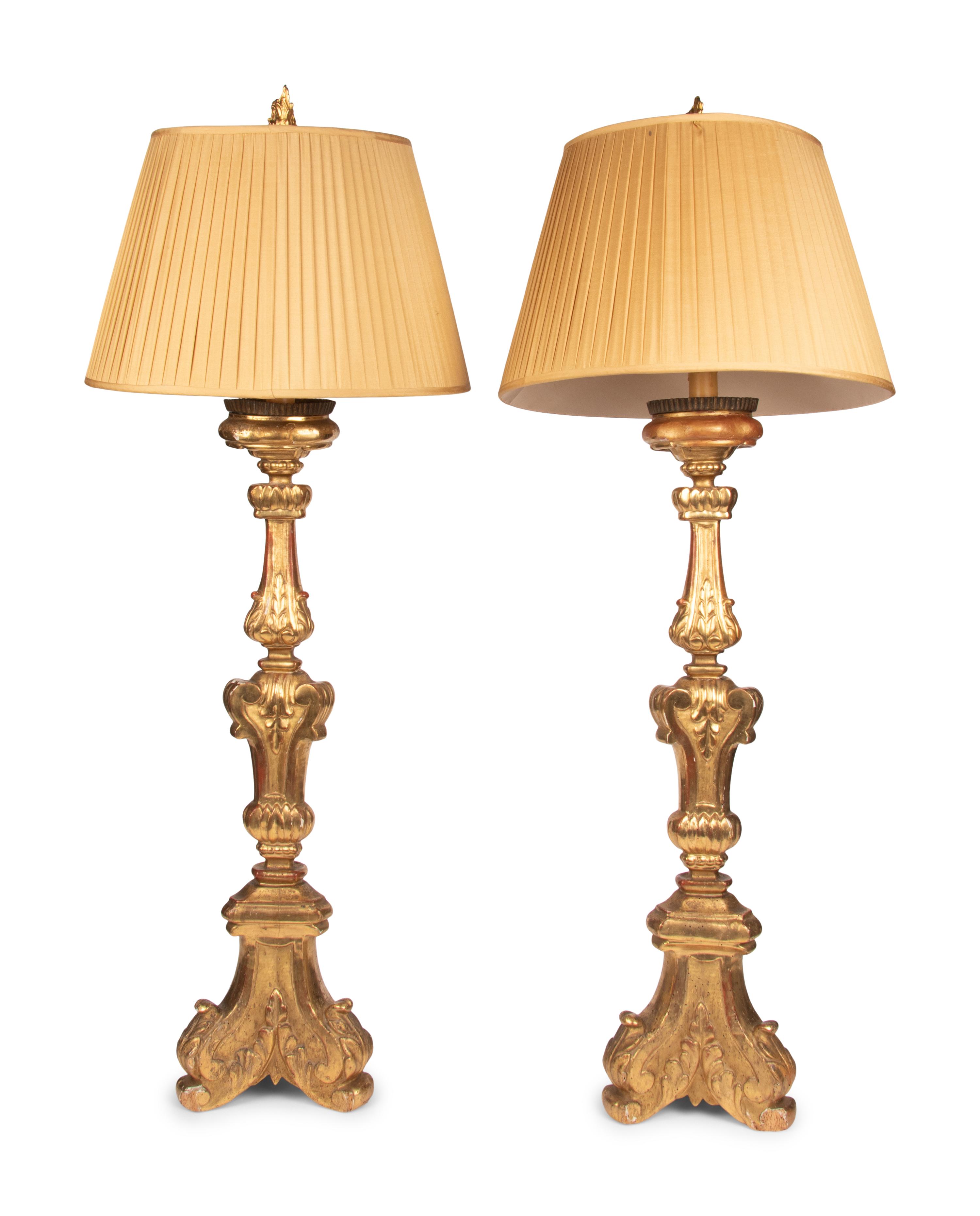 A Pair of Italian Giltwood Prickets Mounted as Lamps