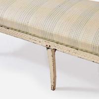 A Northern European cream-painted carved wood settee late 19th / early 20th century