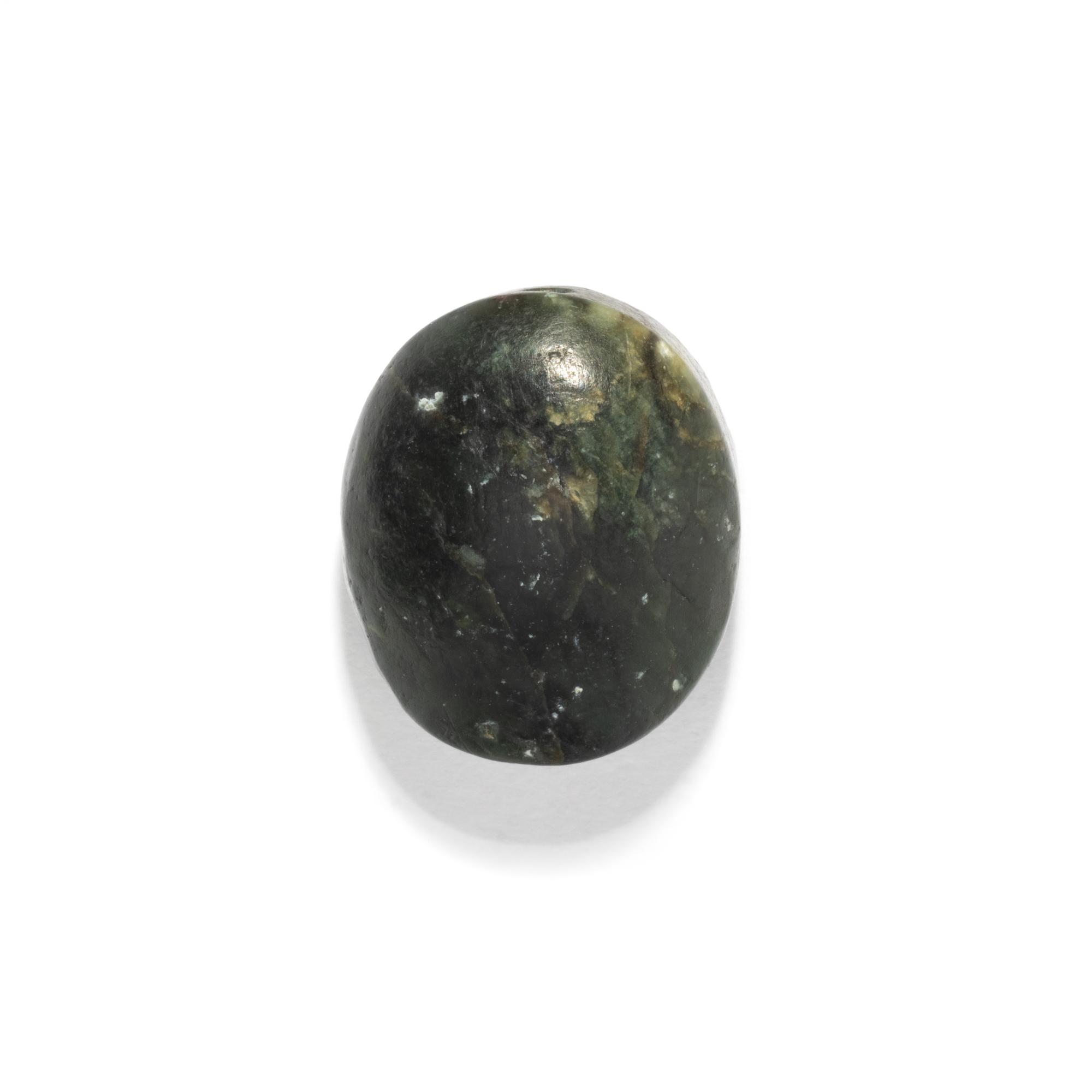 A Greco-Persian Onyx Scaraboid with a Griffin and Winged Sun Disc