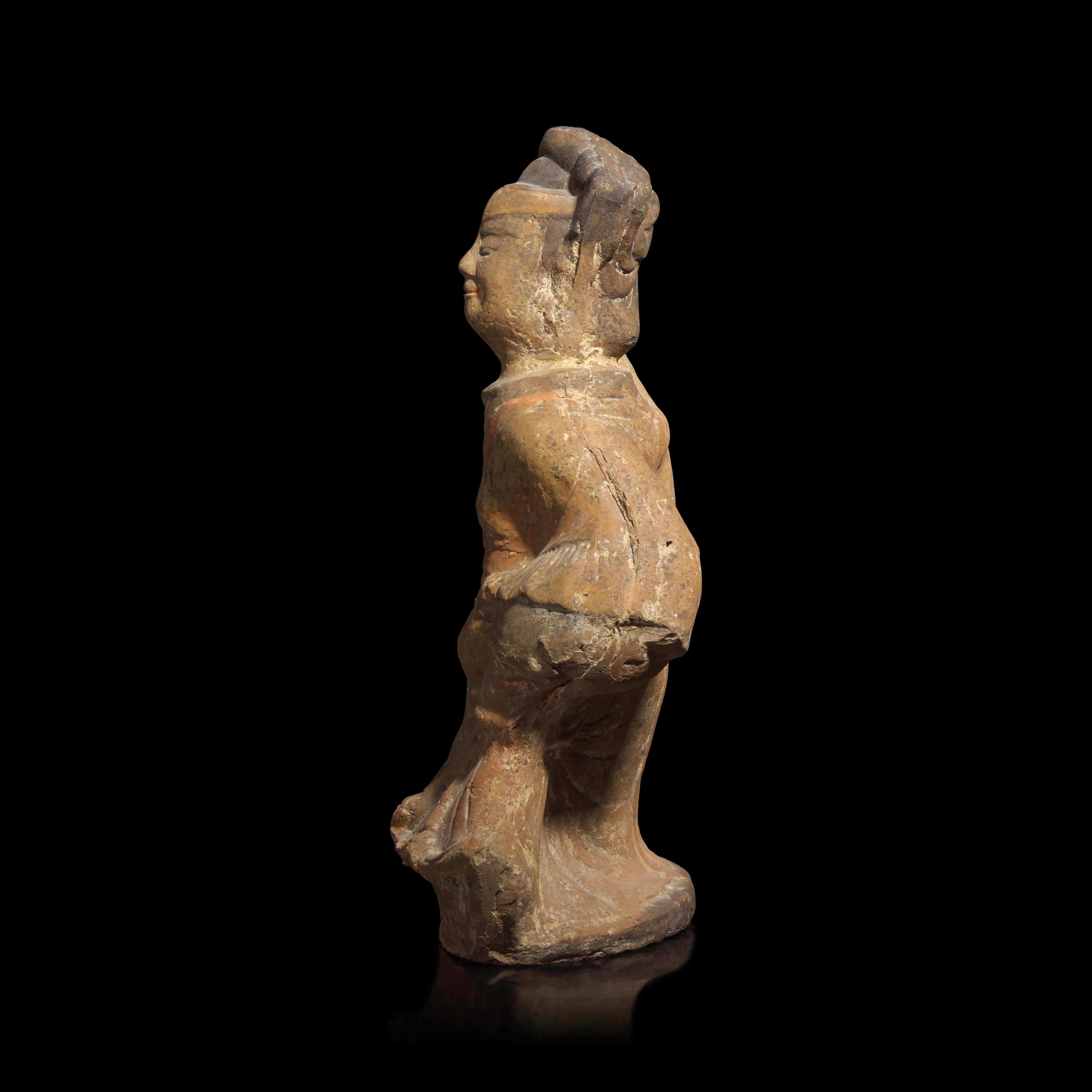 A Chinese Sichuan Style Red Pottery Figure of a Dancer, Han Dynasty — 漢 四川風格灰陶彩繪樂舞俑