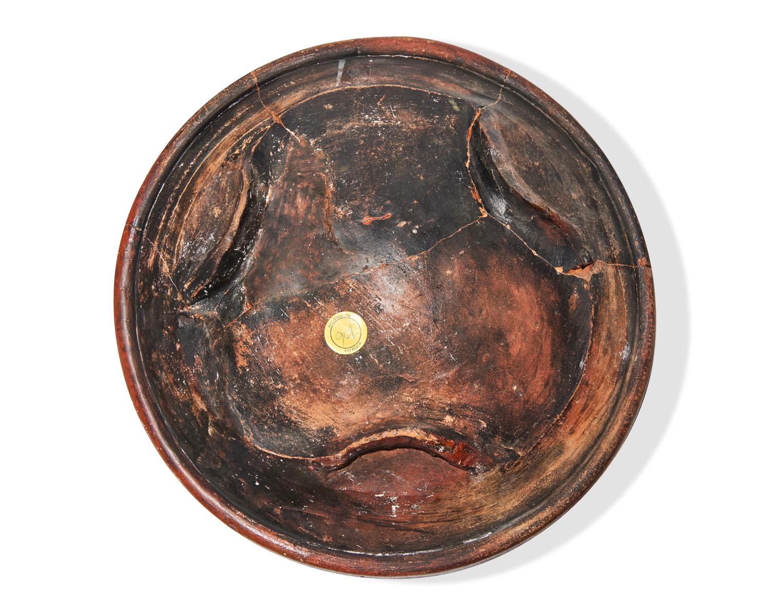 A Dutch Slip-Decorated Earthenware Footed Charger, 17th Century