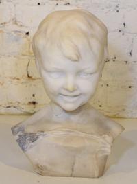 A Carved Marble Bust. Height 13 inches.