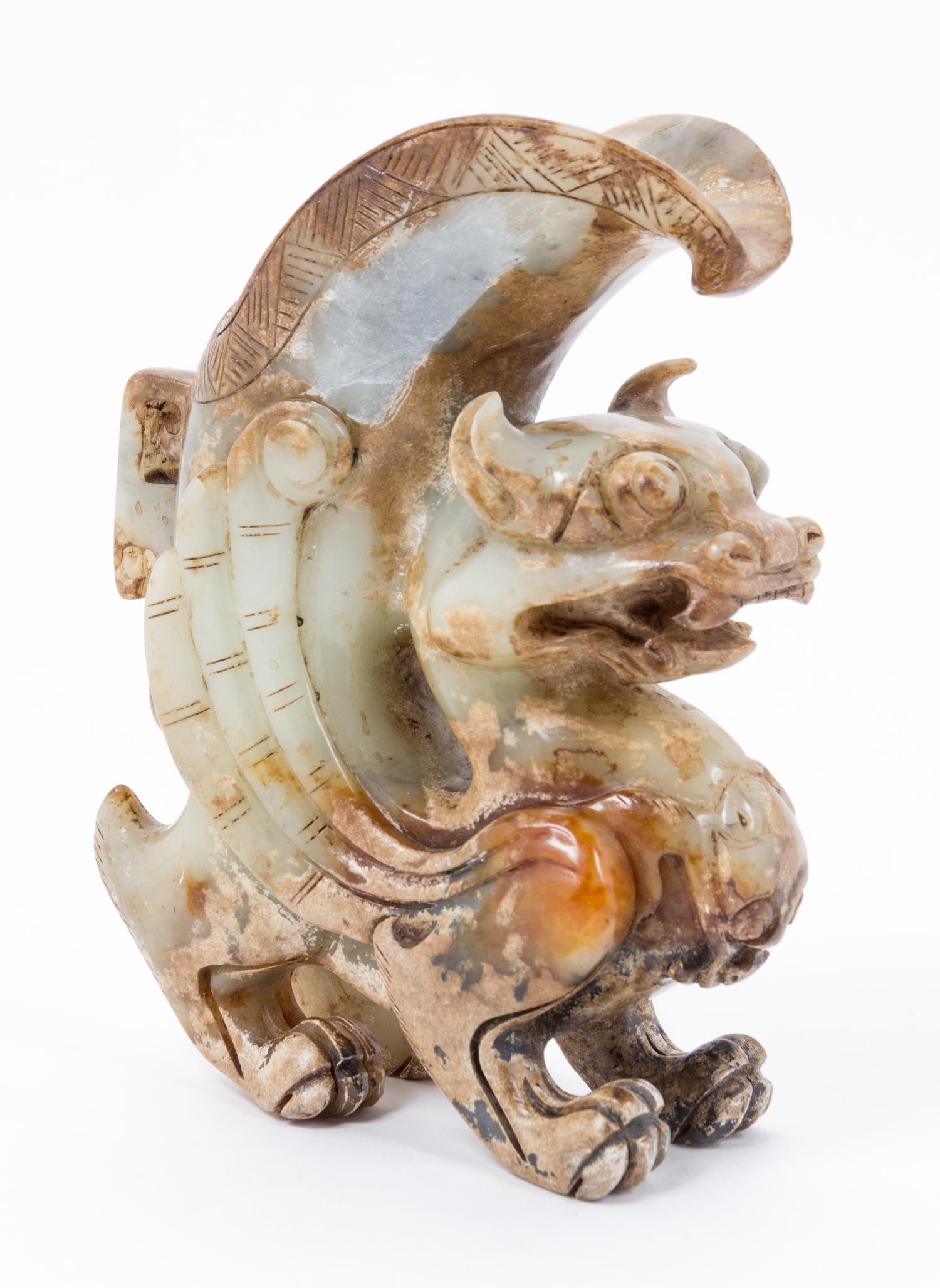 A Chinese Archaistic Jade Figural Carving Height 7 1/2 inches.
