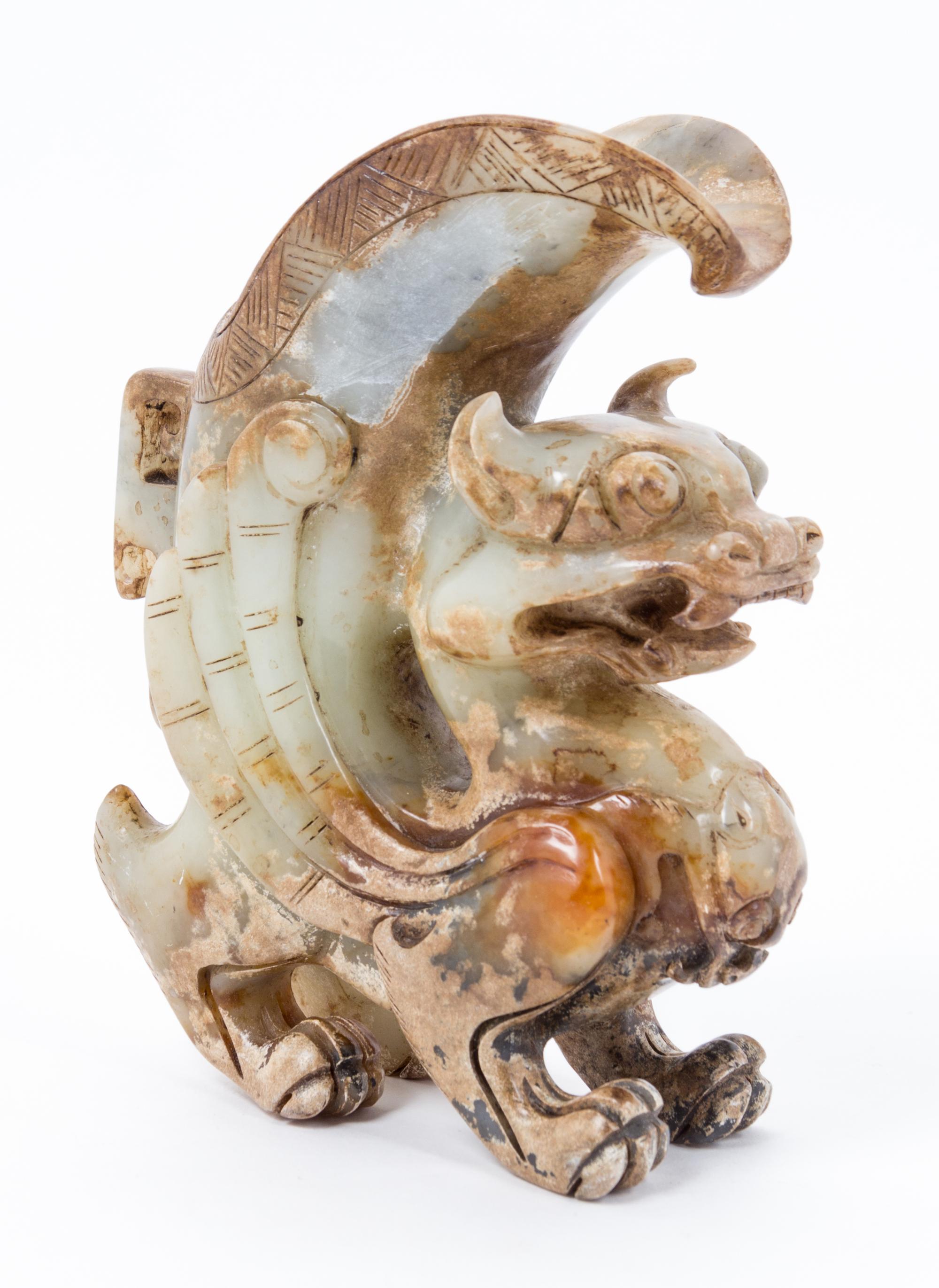 A Chinese Archaistic Jade Figural Carving Height 7 1/2 inches.