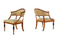 A Pair of Empire Style Parcel Gilt and Ebonized Bergères