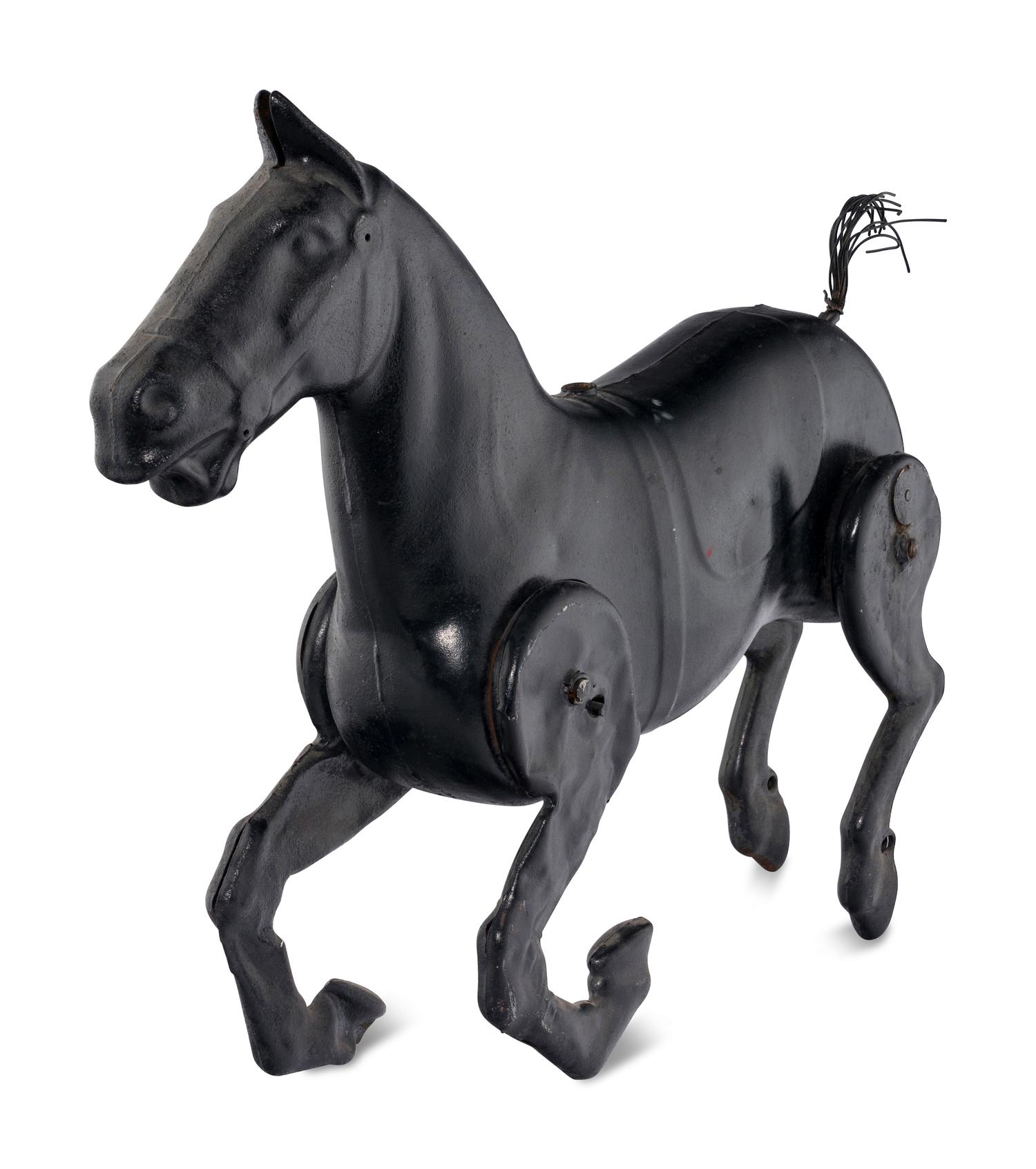 A Pressed Metal Horse Carousel Figure