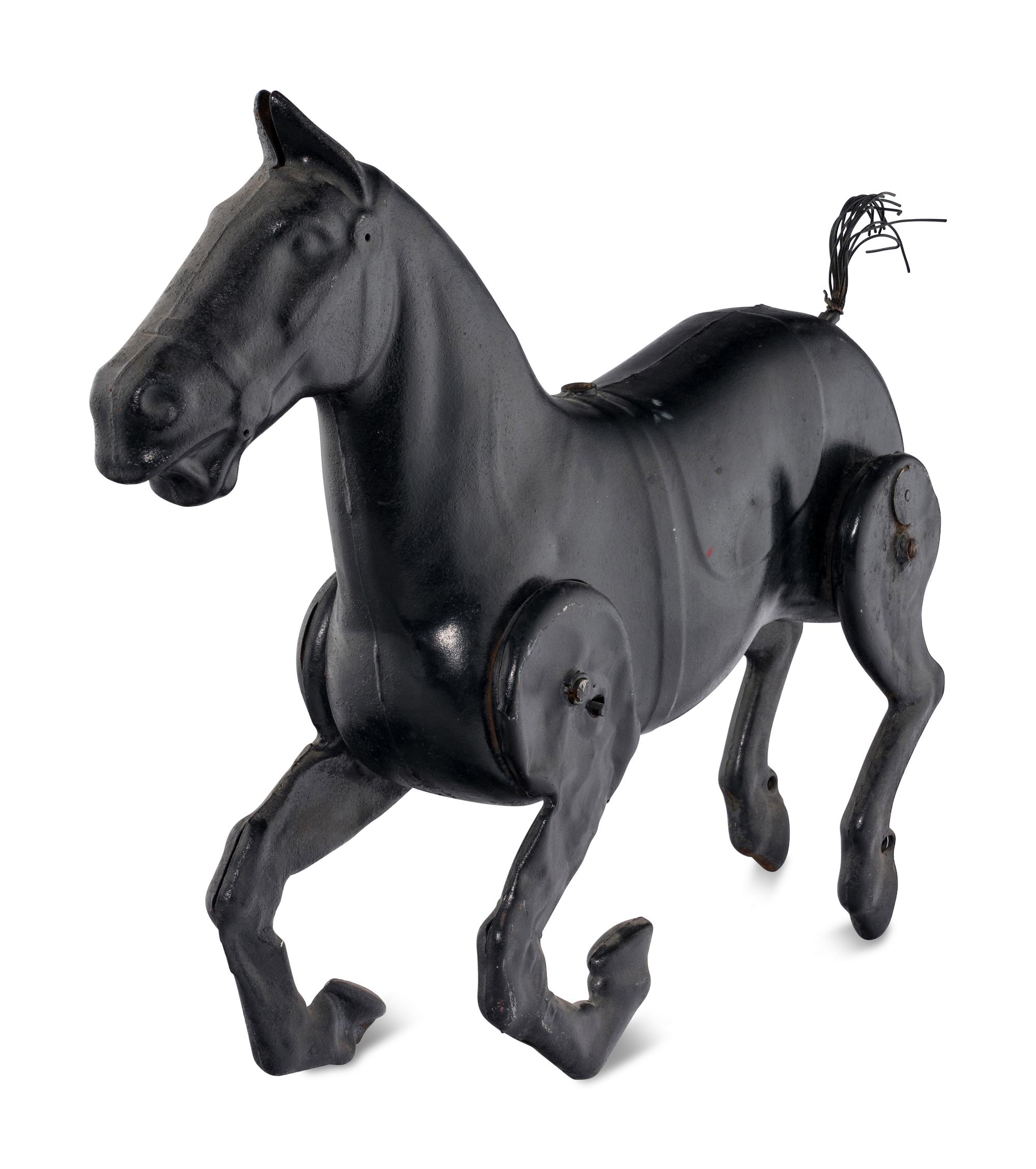 A Pressed Metal Horse Carousel Figure