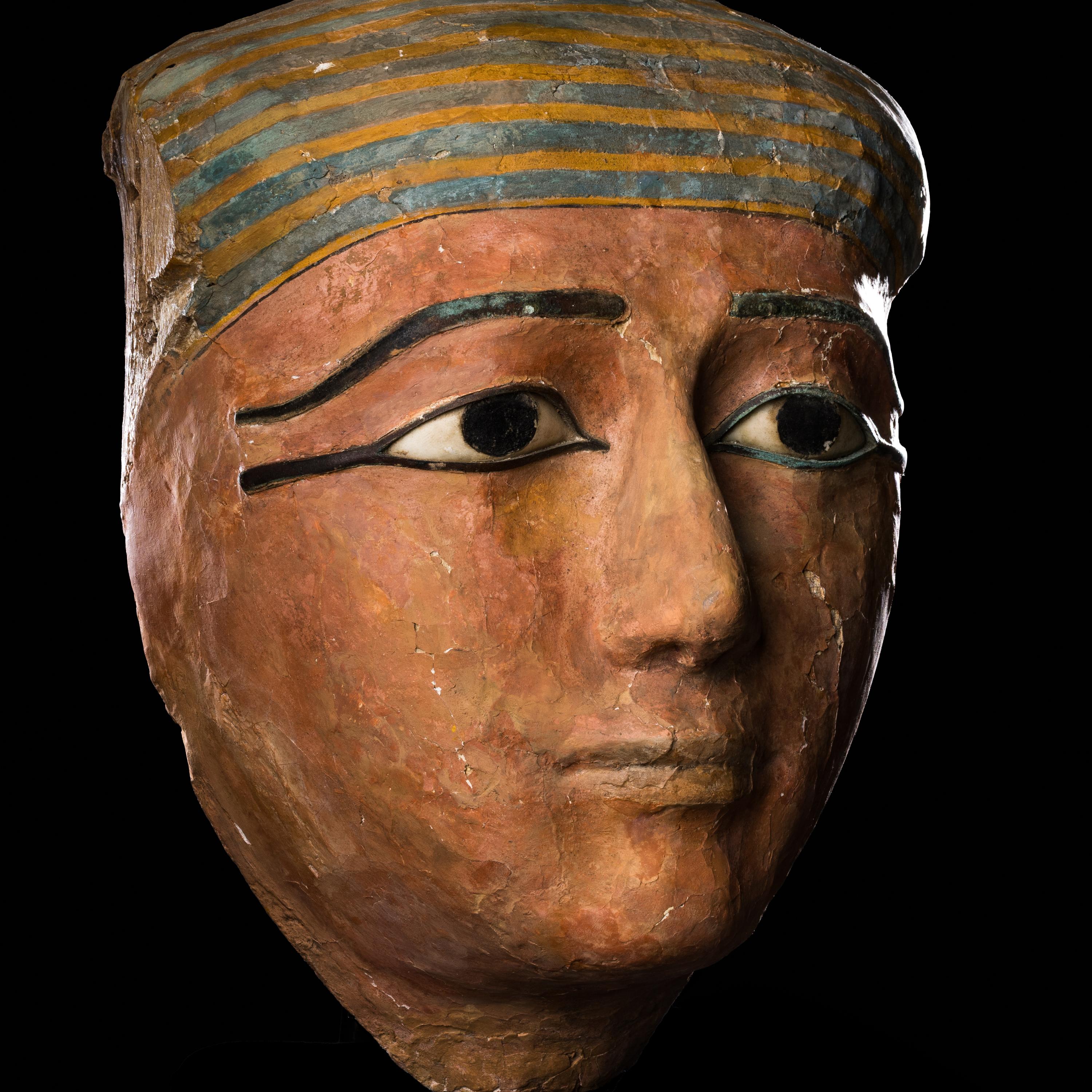 An Egyptian Polychrome Wood Mummy Mask with Bronze Inlays | Freeman's