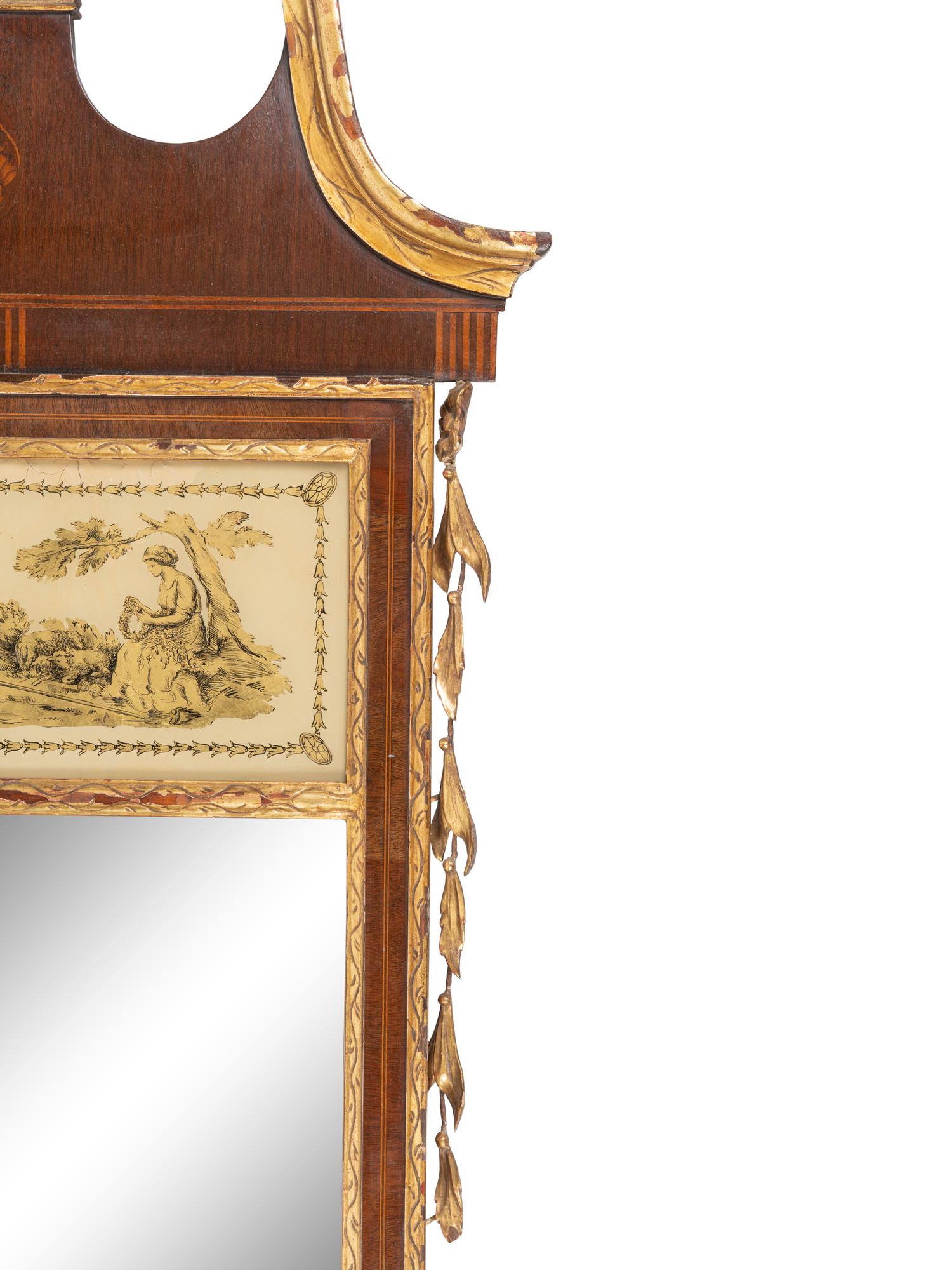 A Federal Style Parcel Gilt Mahogany and Églomisé Mirror