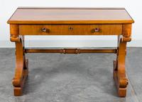 A Regency Style Writing Table Height 29 3/4 x width 43 3/4 x depth 25 inches.