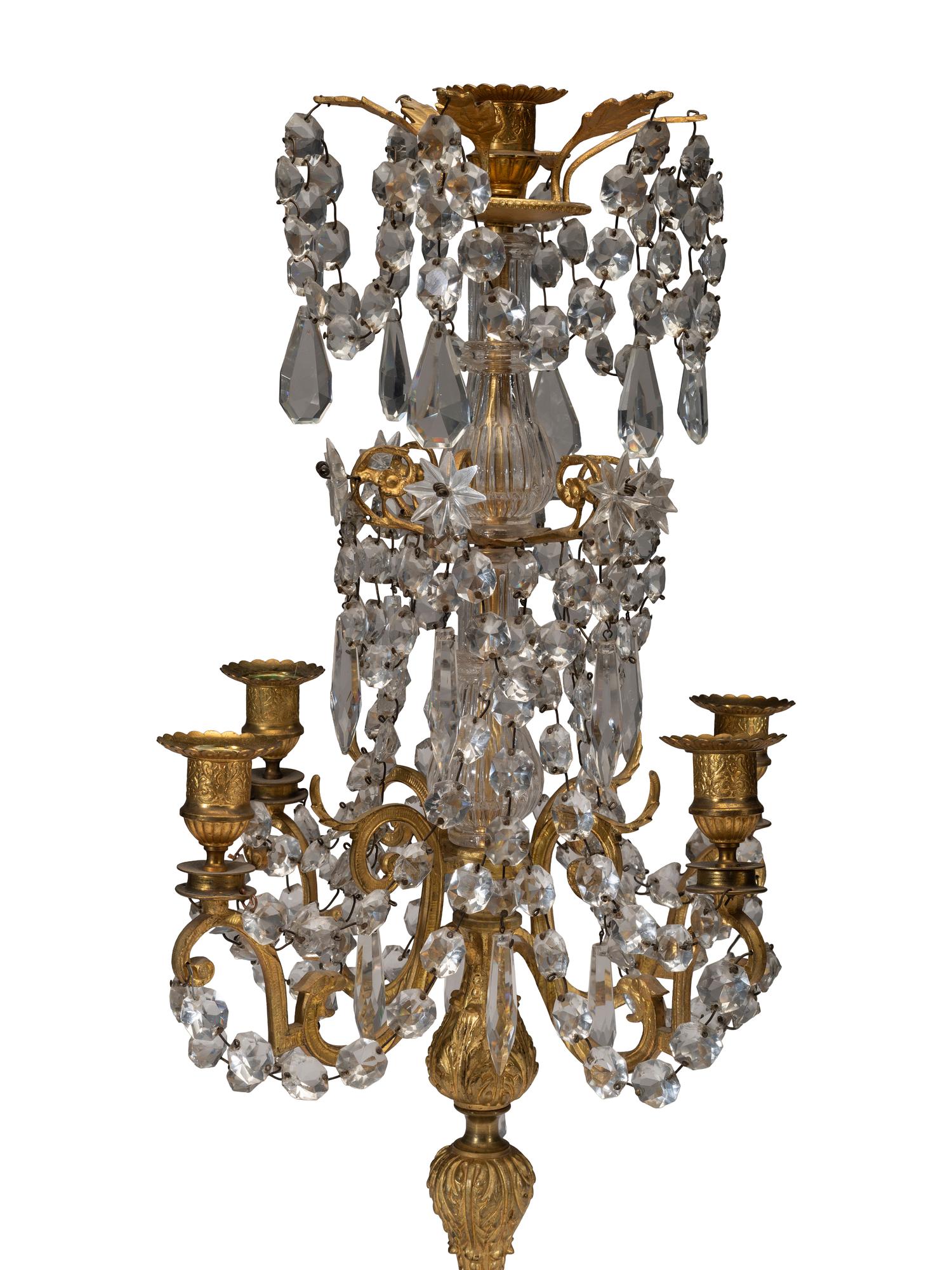 A Pair of Gilt-Bronze and Crystal Five-Light Candelabra