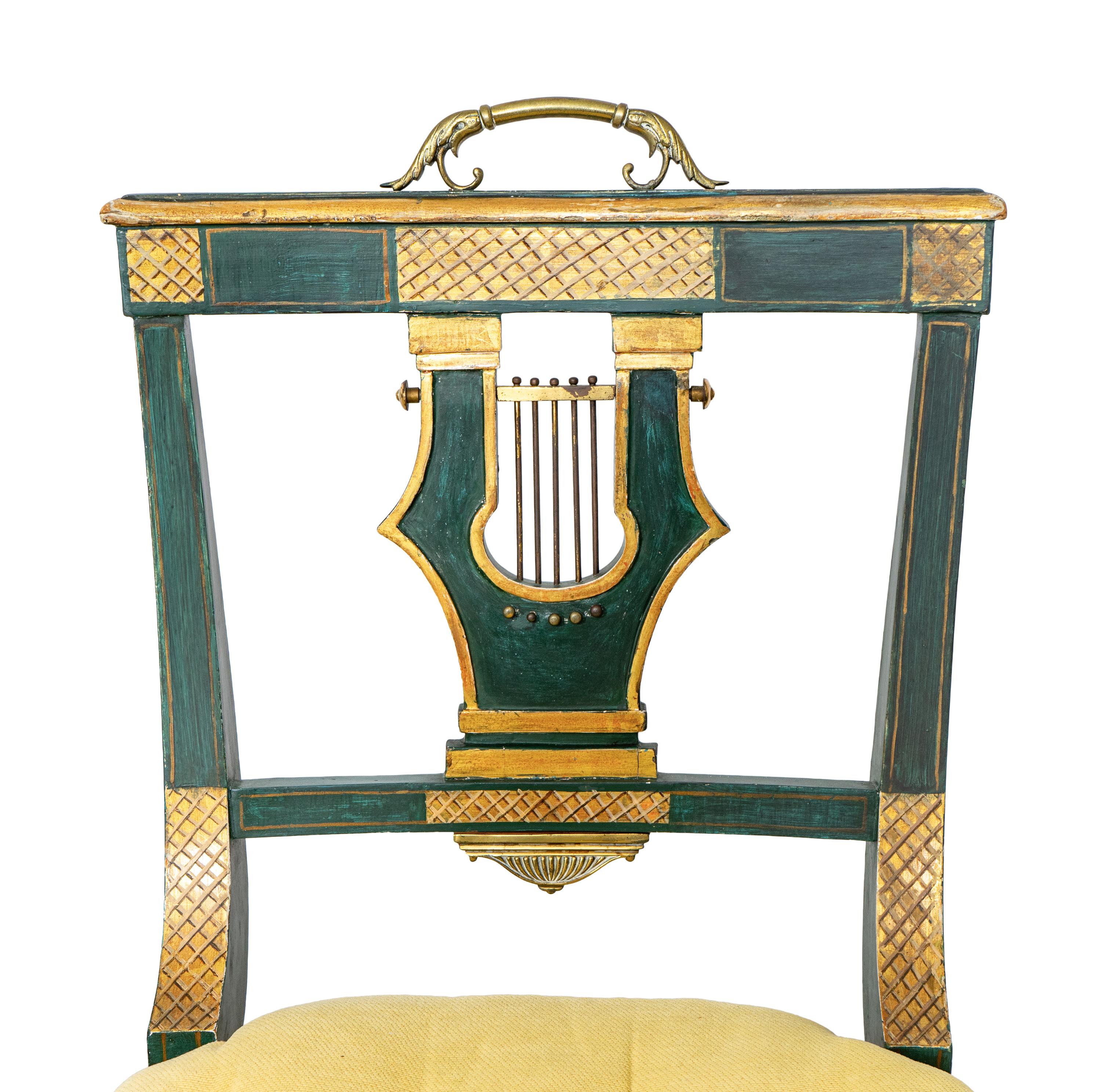 A Set of Eight Continental Green Painted and Parcel Gilt Lyre-Back Dining Chairs