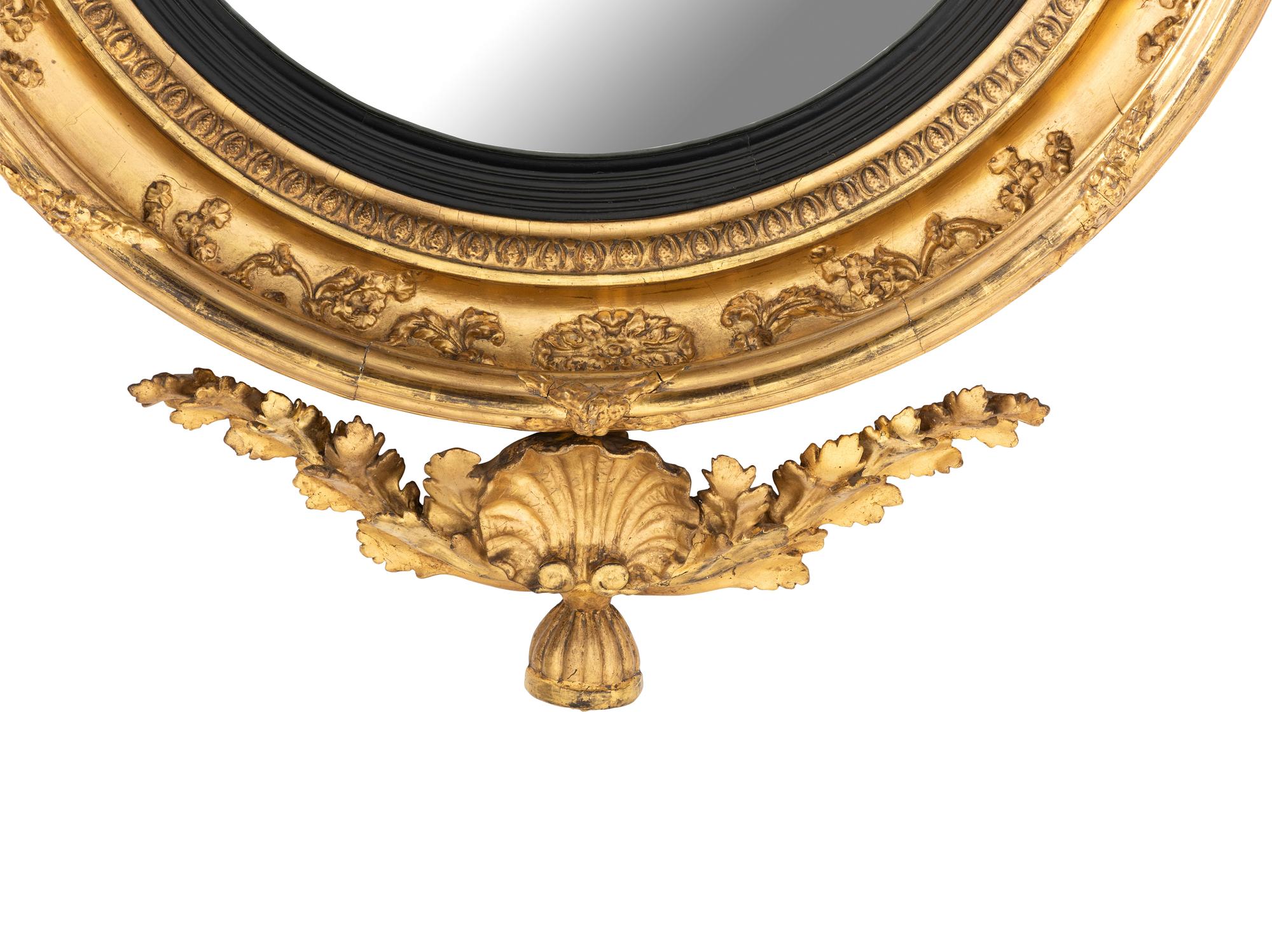 A Large Federal Carved Giltwood and Gesso Bull's-Eye Looking Glass