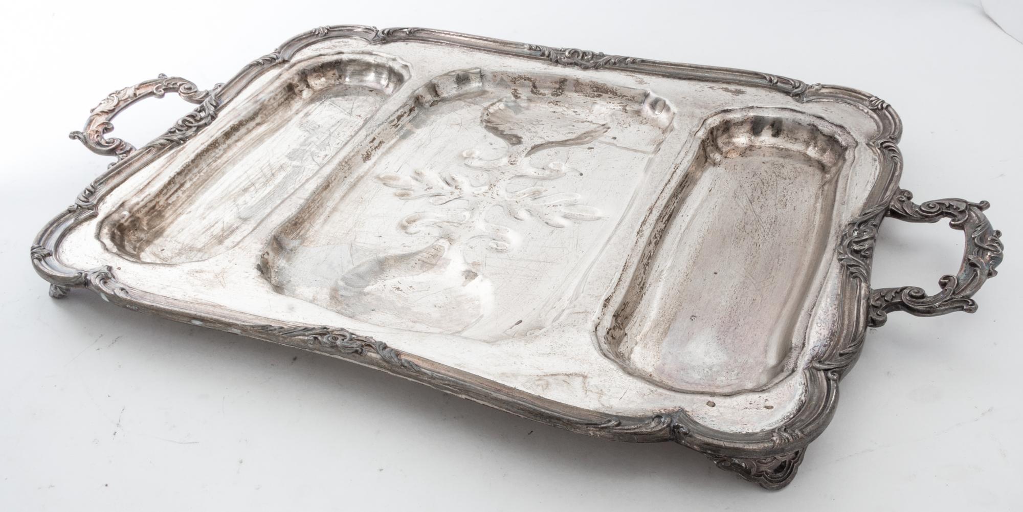 A Group of Silver-Plate Serving Trays Width of widest over handles 30 inches.