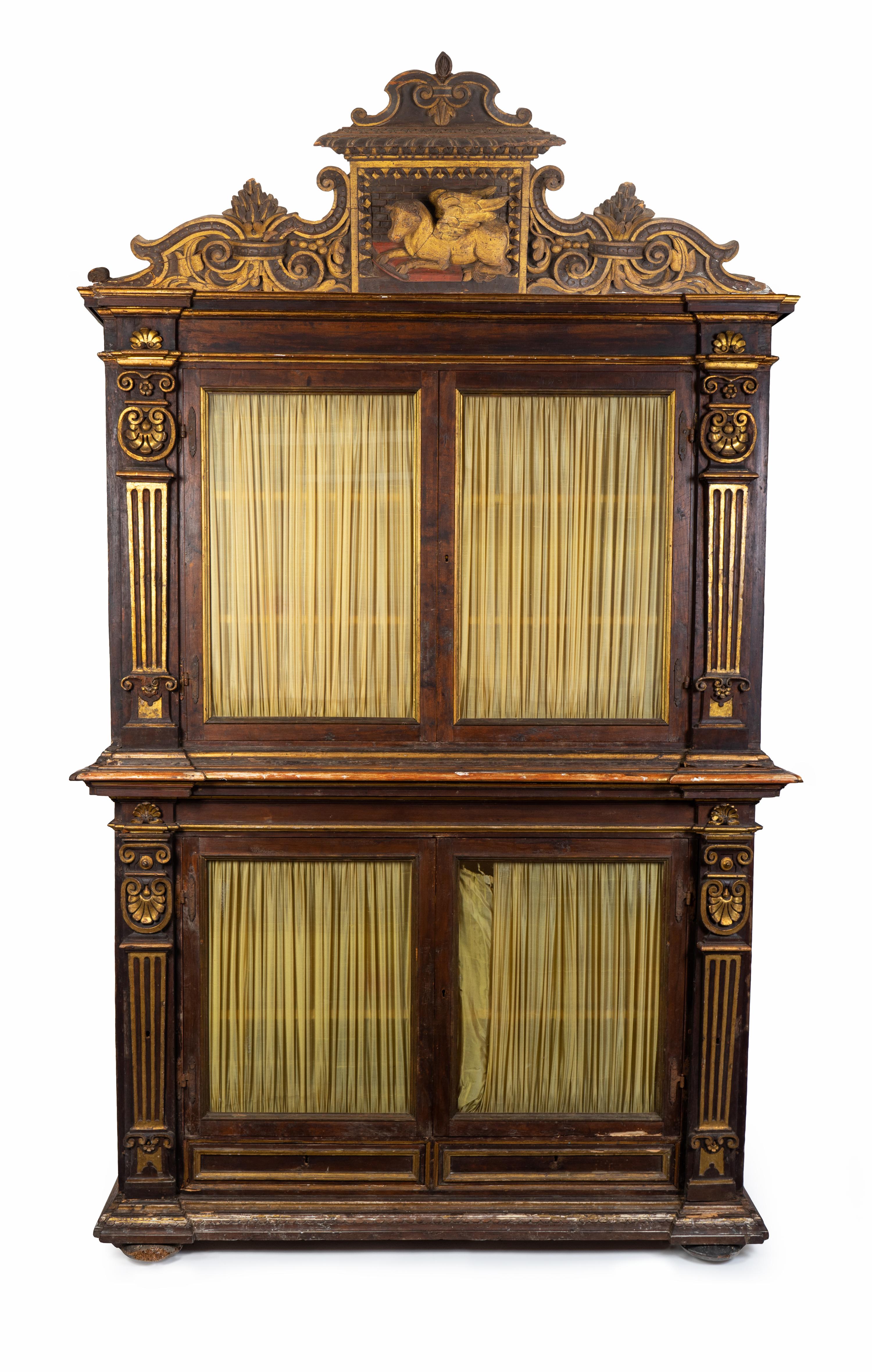 An Italian Neoclassical Parcel-Gilt and Carved Walnut Bookcase — LATE 18TH CENTURY