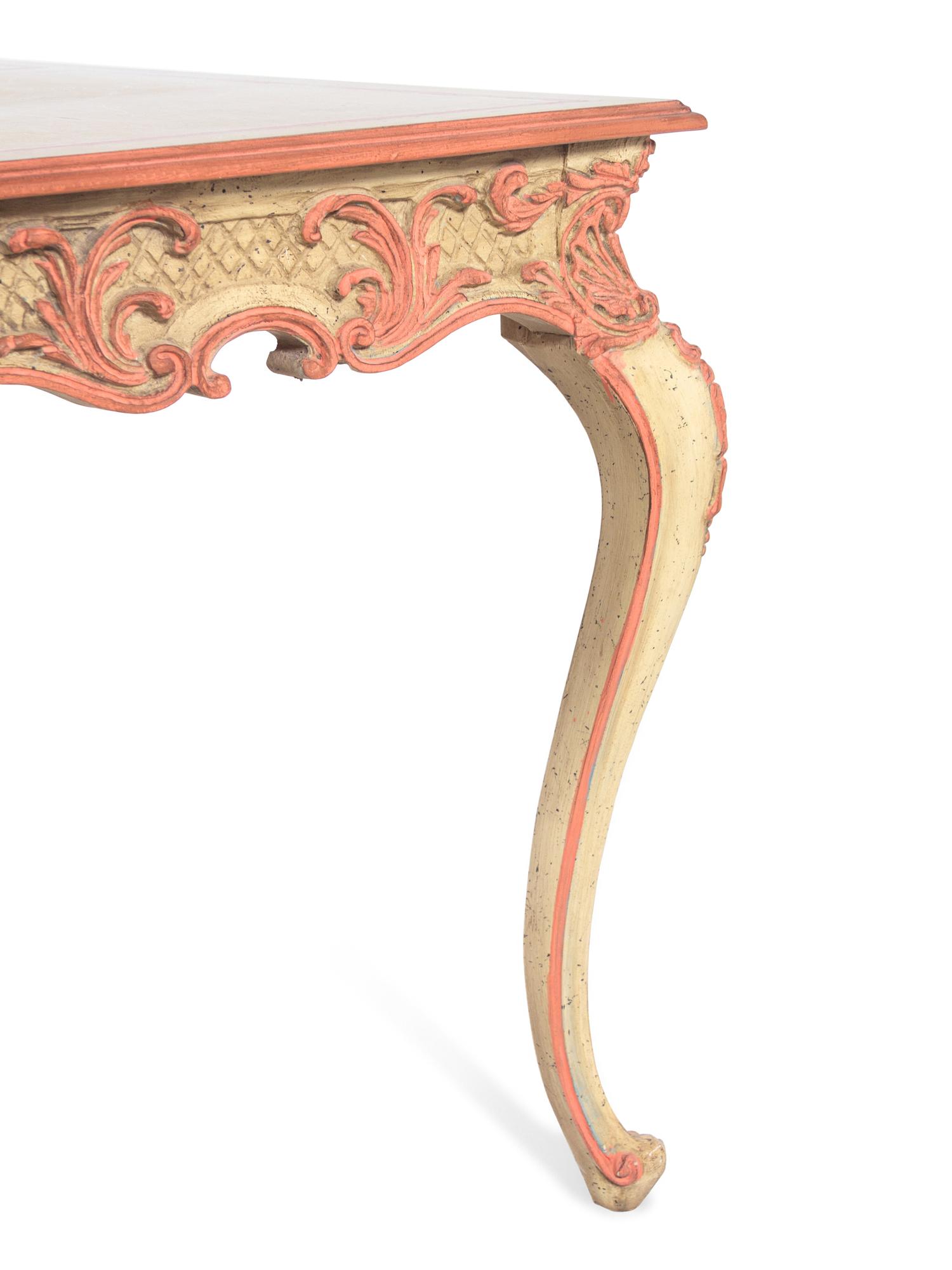 An Italian Baroque Style Pink and Cream Painted Center Table