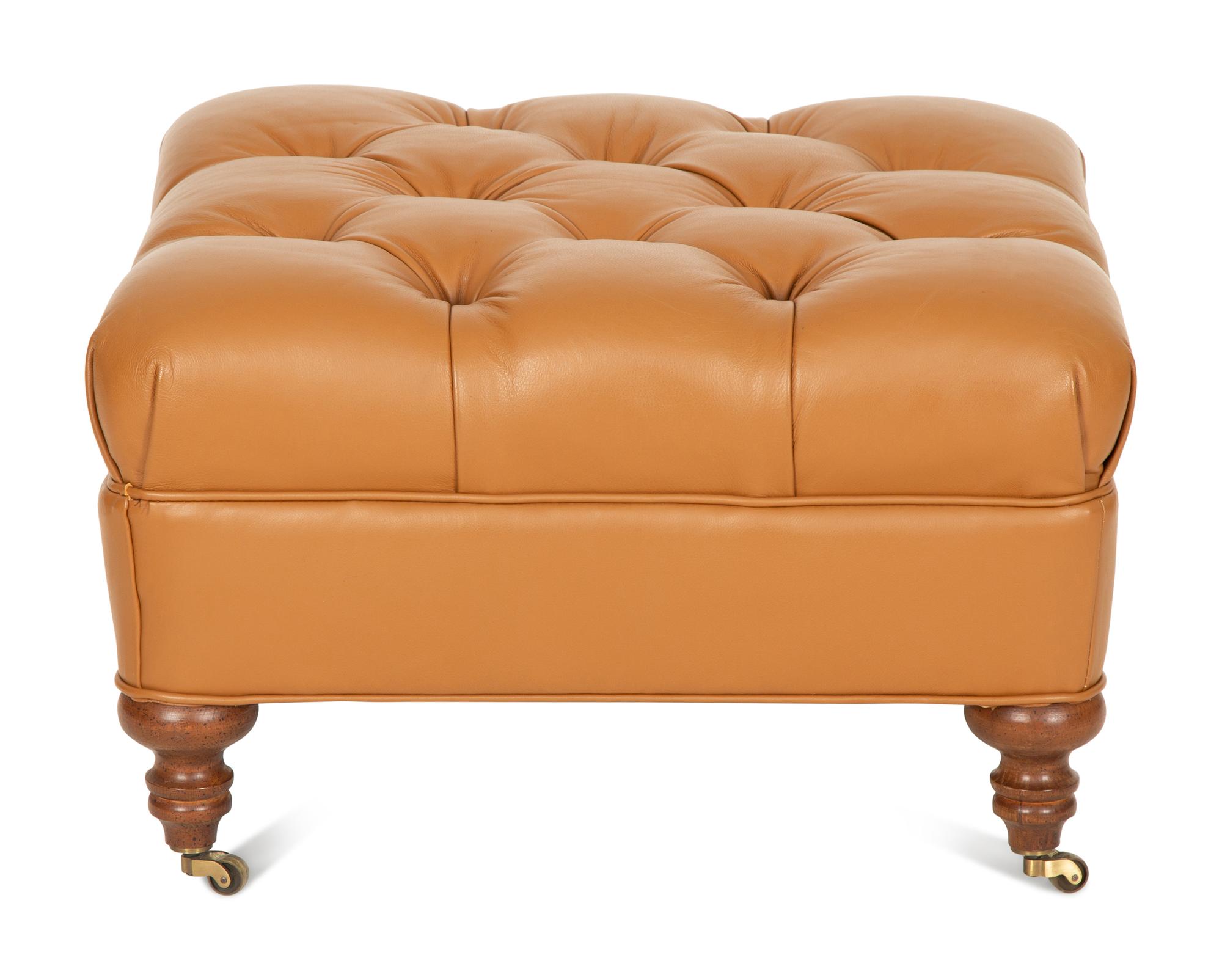A Regency Style Brown Tufted Leather Upholstered Ottoman