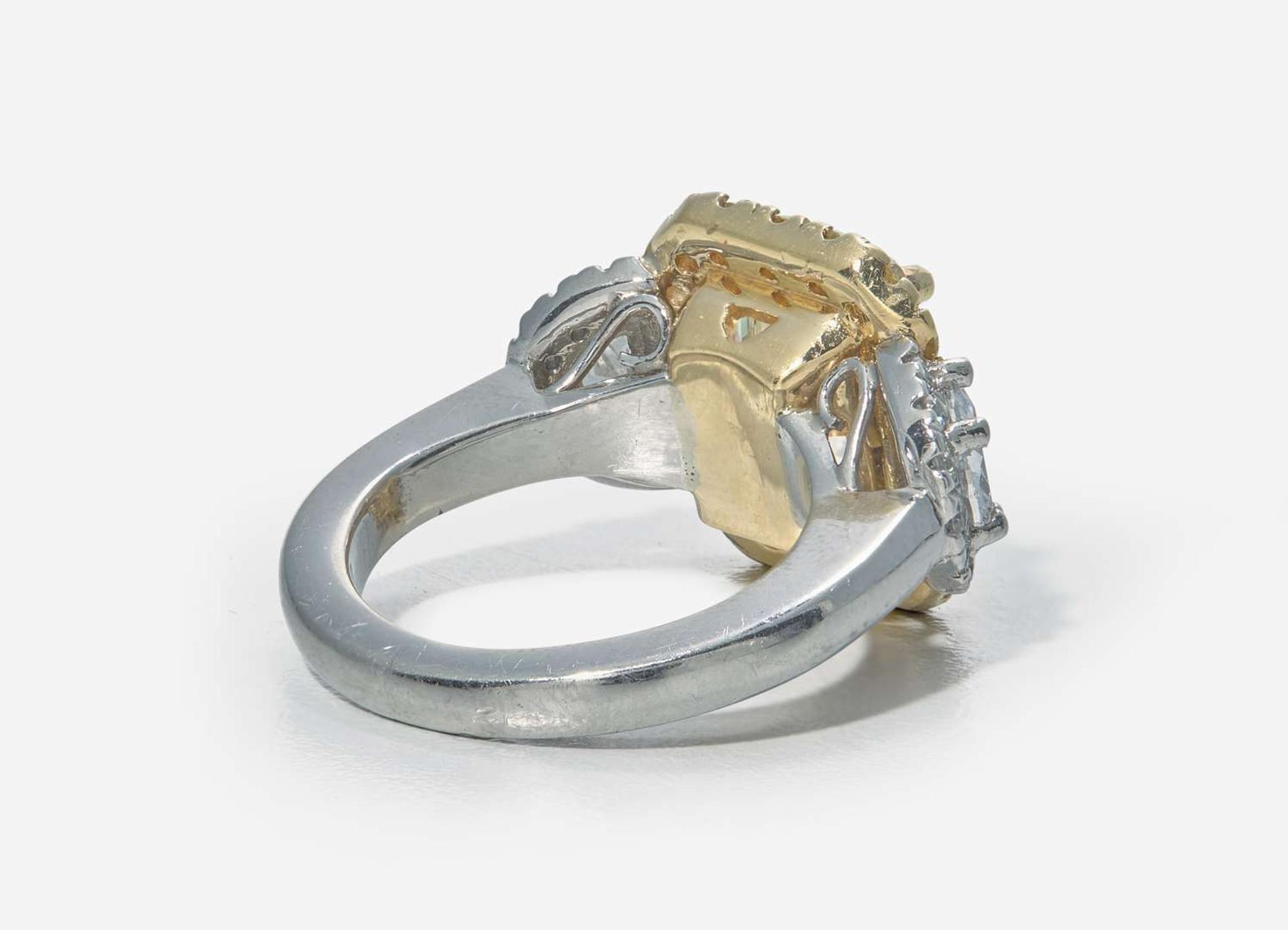 A Platinum, 18K Yellow Gold, Diamond, and 5.12 Carat Yellow Diamond Ring
