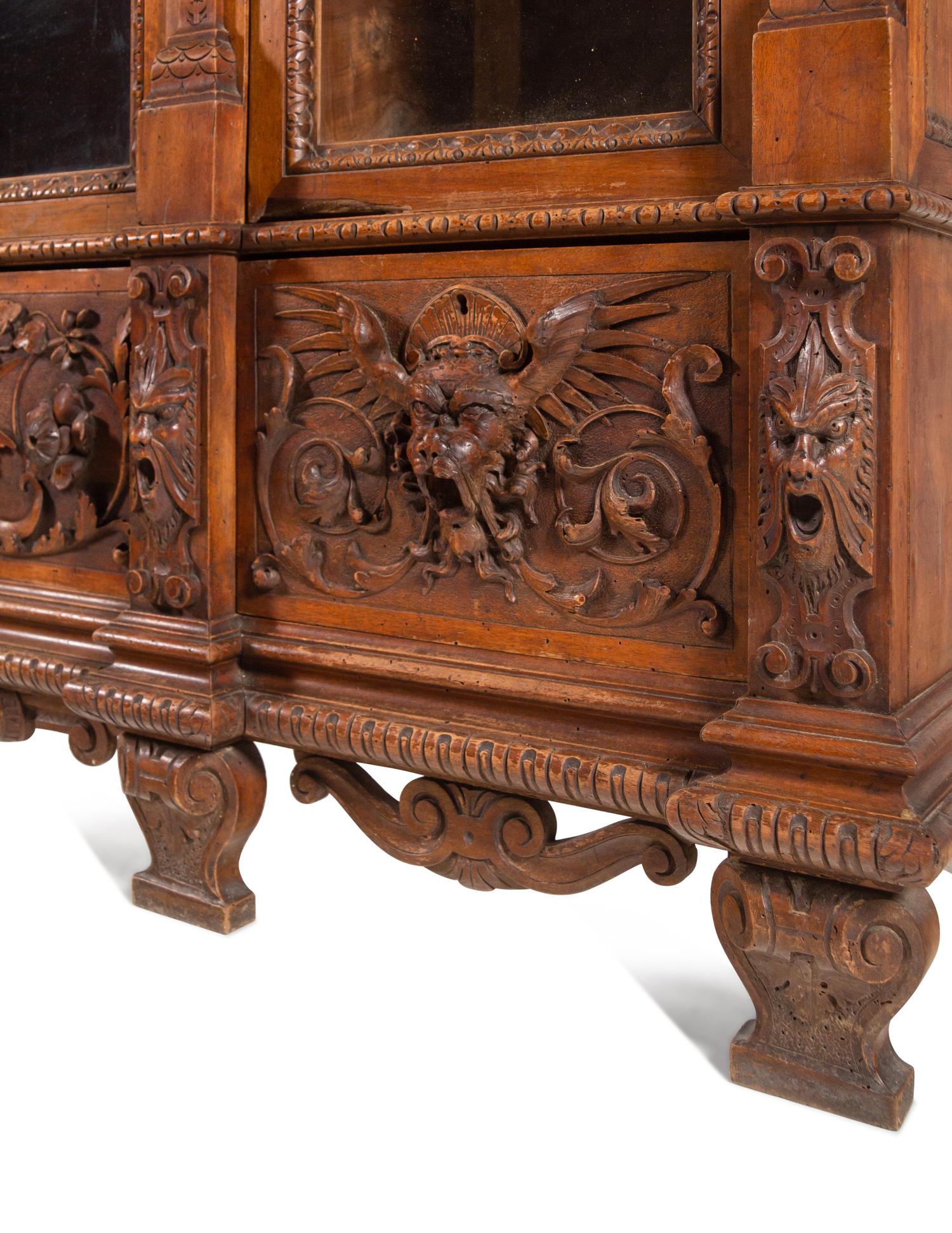 An Italian Renaissance Style Carved Walnut Cabinet