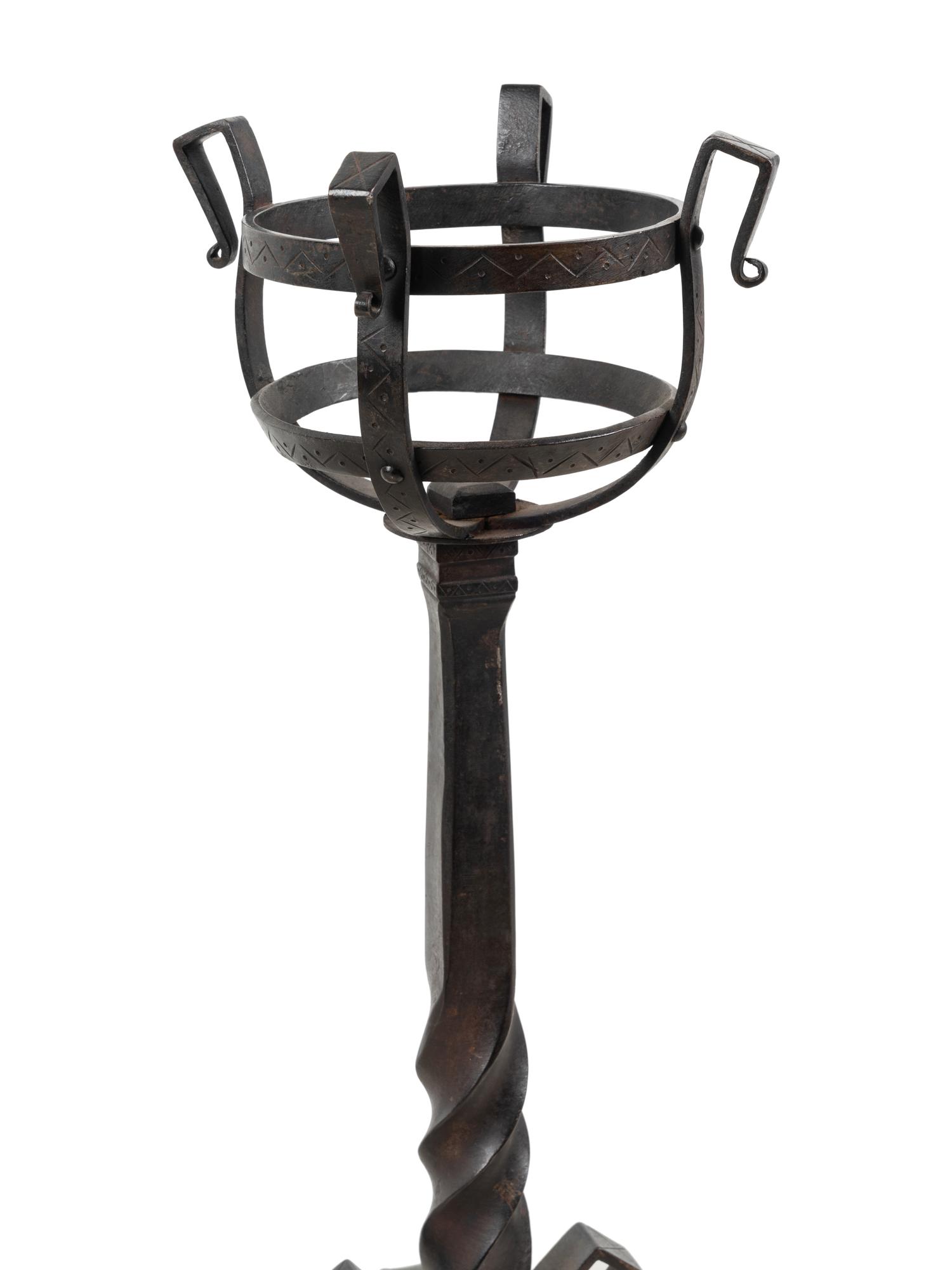 A Pair of Continental Iron Andirons