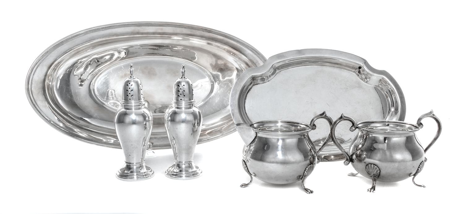 A Group of American Silver Table Articles, 20th Century, comprising a sugar and creamer set with underdish, two casters and a oval form