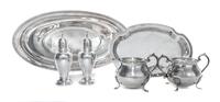 A Group of American Silver Table Articles, 20th Century, comprising a sugar and creamer set with underdish, two casters and a oval form