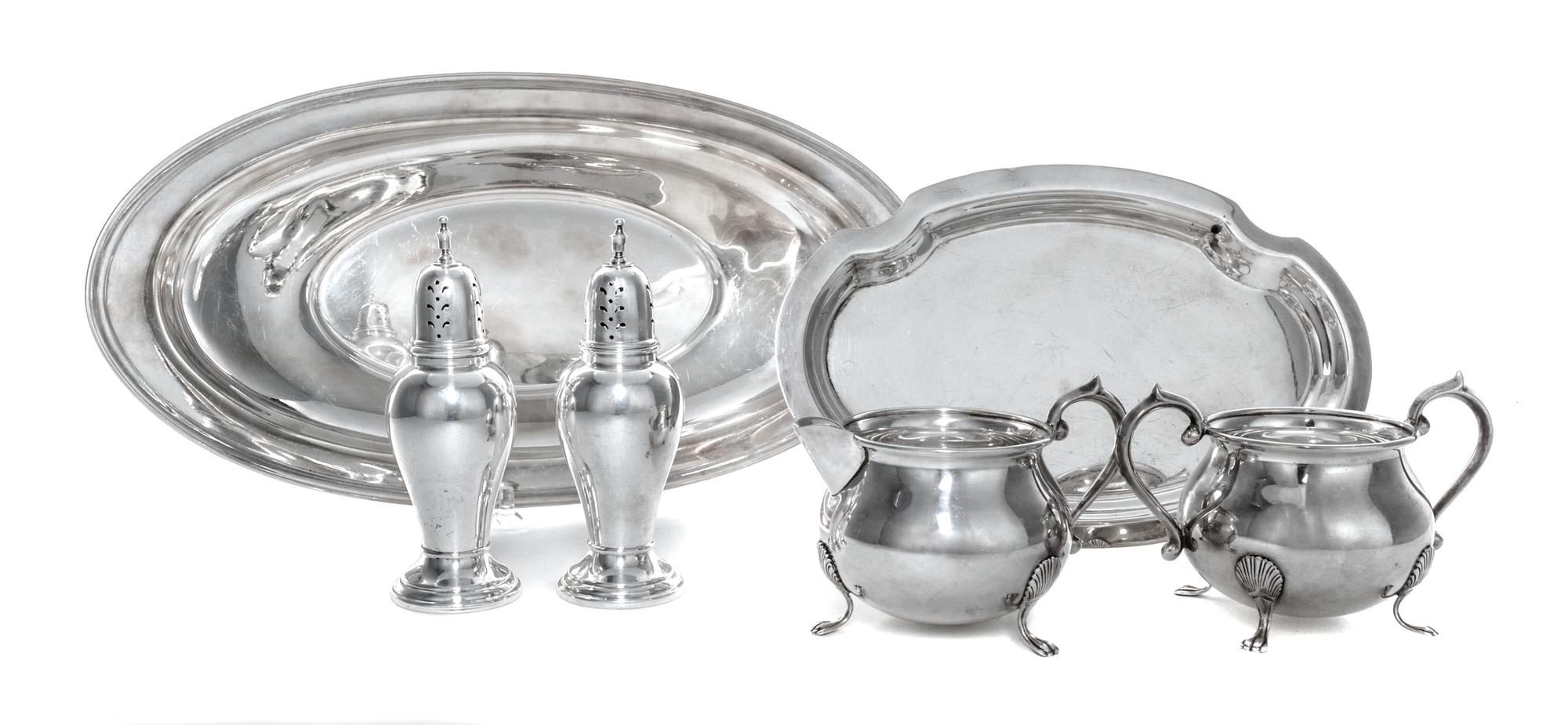 A Group of American Silver Table Articles, 20th Century, comprising a sugar and creamer set with underdish, two casters and a oval form