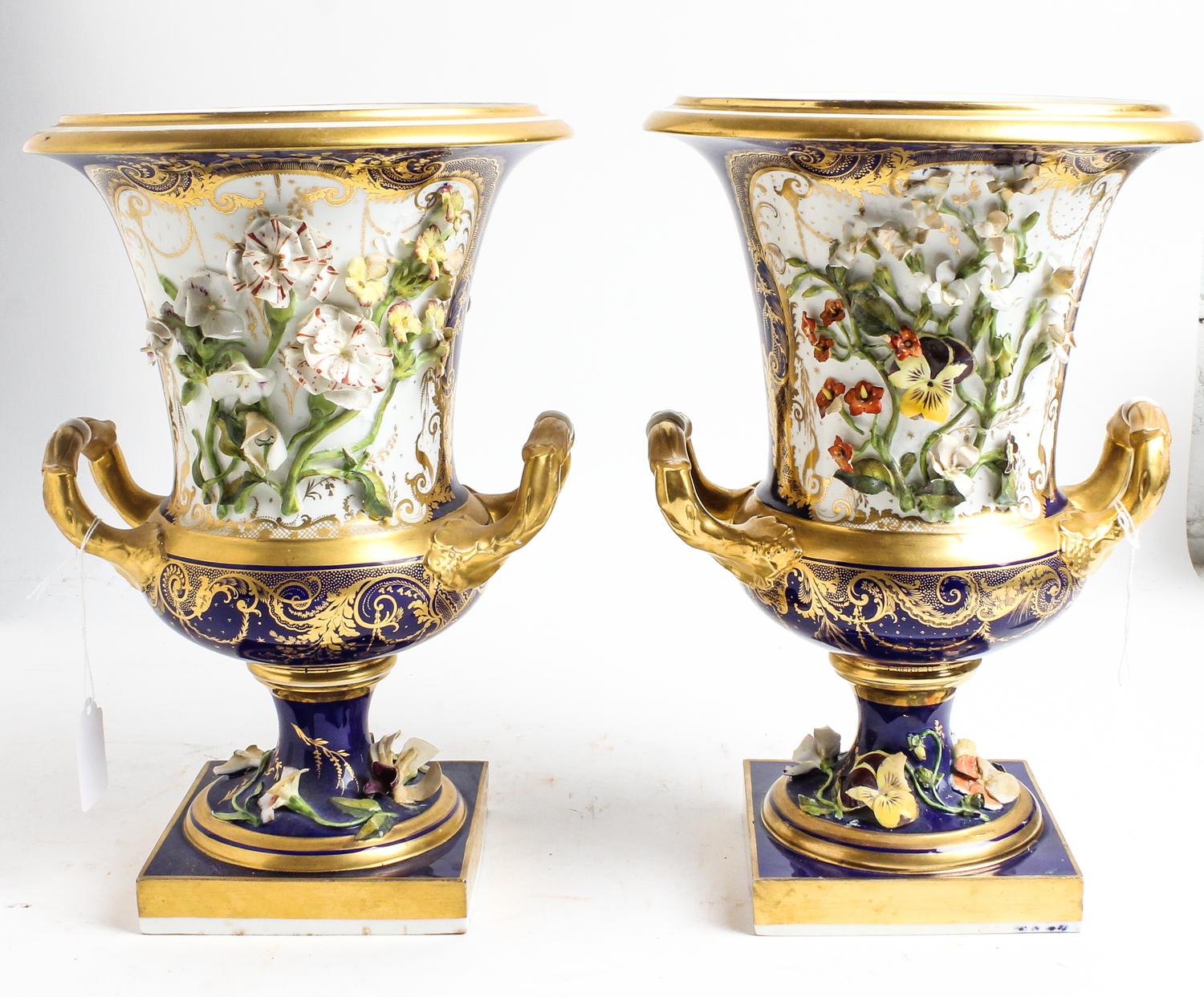 A Pair of Continental Porcelain Urns Height 12 1/2 inches. — 20TH CENTURY