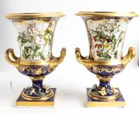 A Pair of Continental Porcelain Urns Height 12 1/2 inches. — 20TH CENTURY