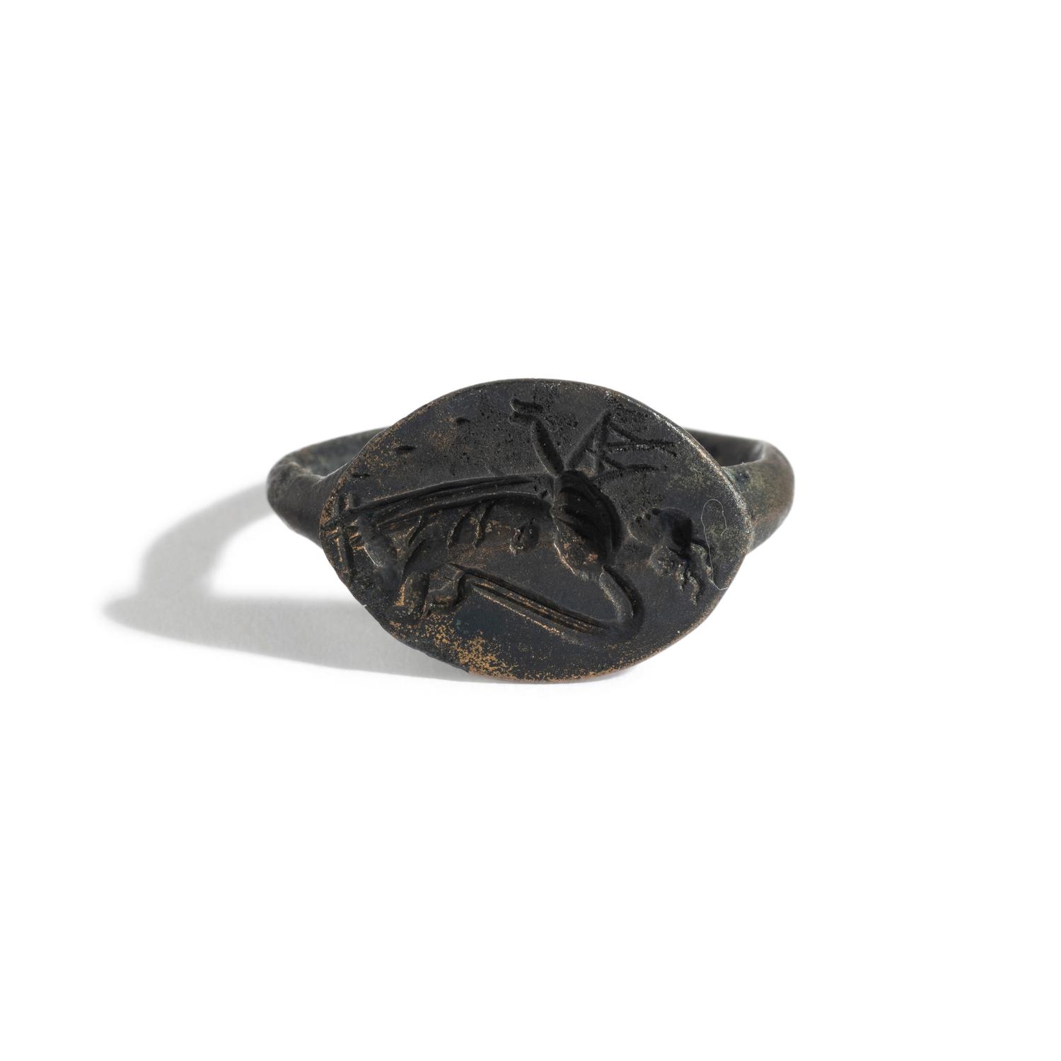 A Greek Bronze Finger Ring with a Nymph Sowing Seeds