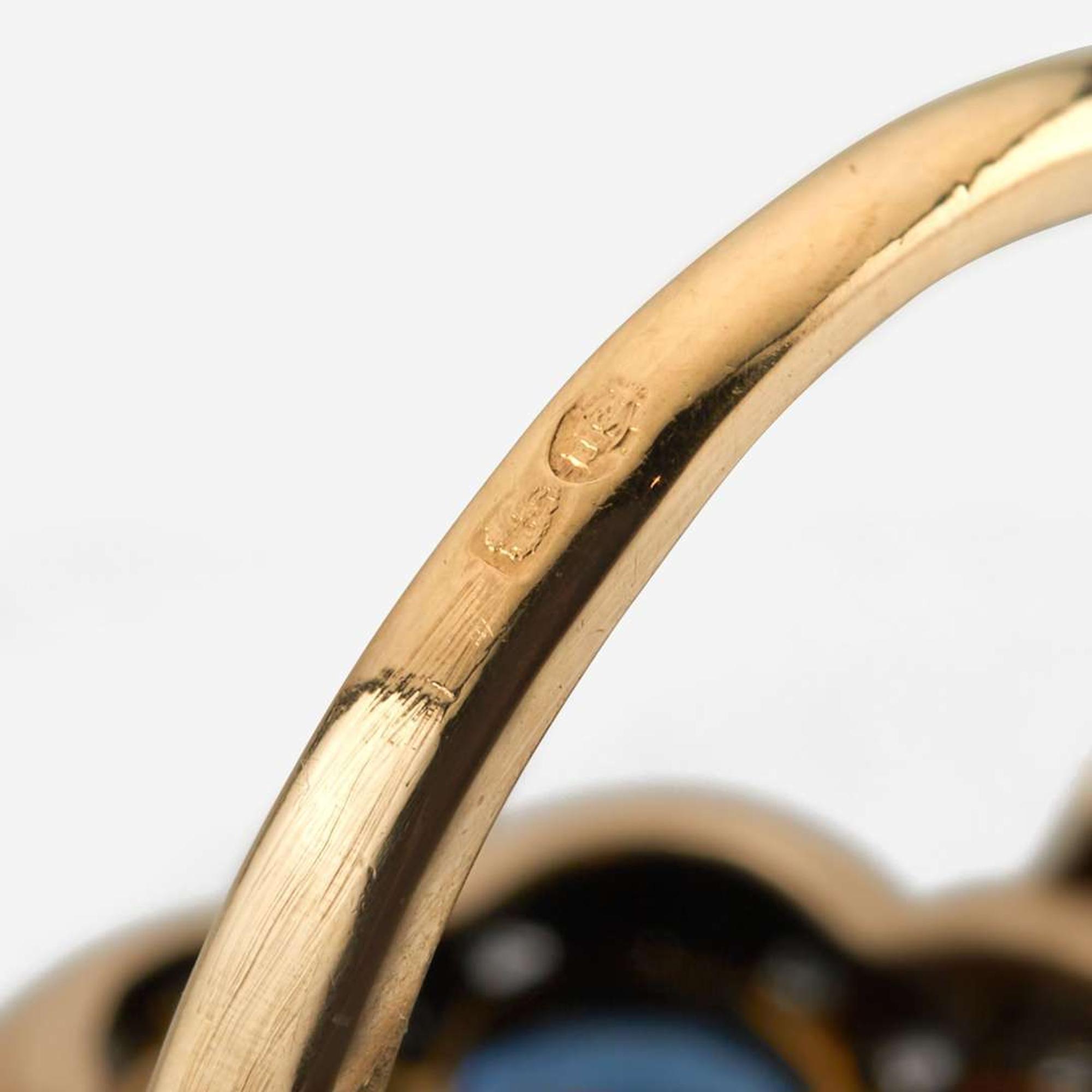 A sapphire, diamond, and platinum topped gold ring