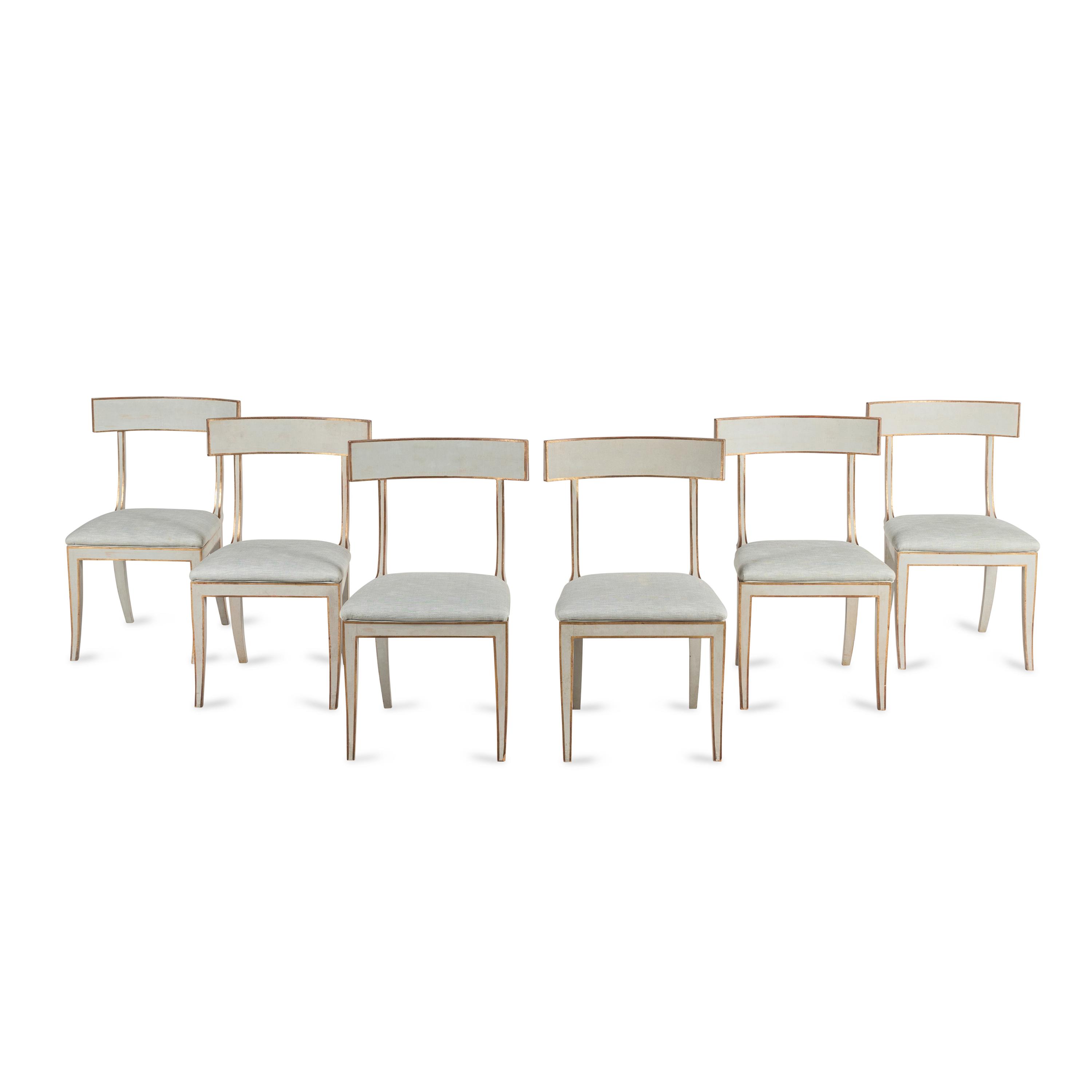 A Group of Six Light Blue-Painted and Parcel-Gilt Klismos Dining Chairs