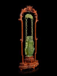 A Chinese Carved Serpentine Hanging Covered Vase