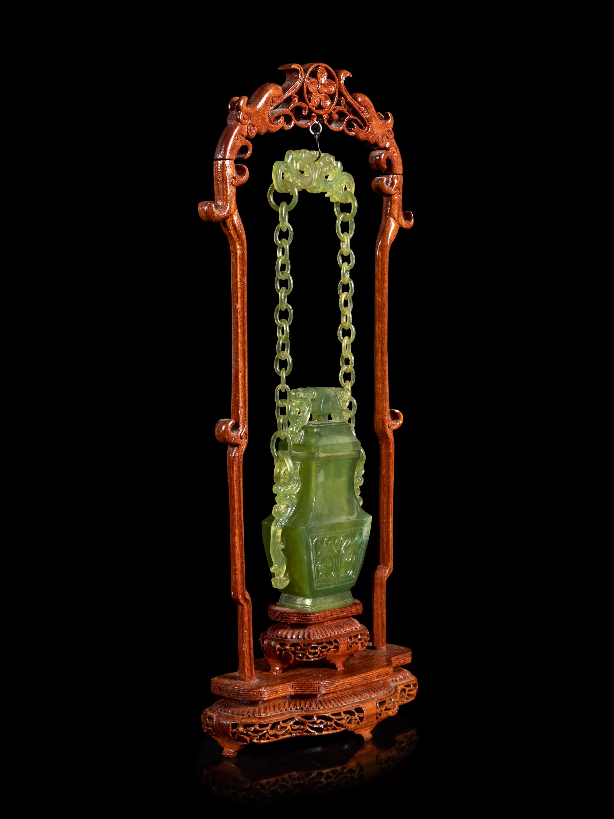 A Chinese Carved Serpentine Hanging Covered Vase
