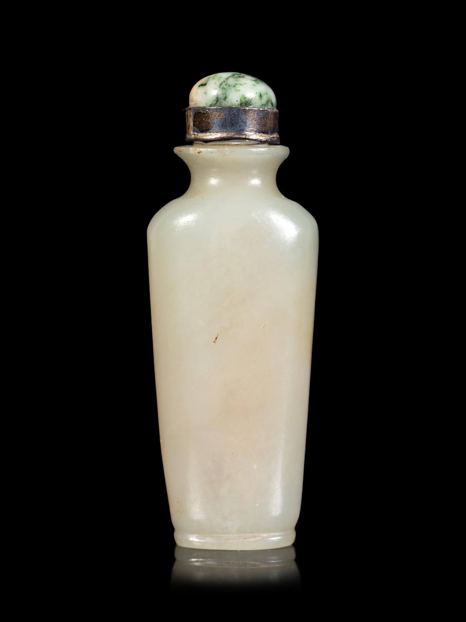 A Celadon and Russet Jade Snuff Bottle