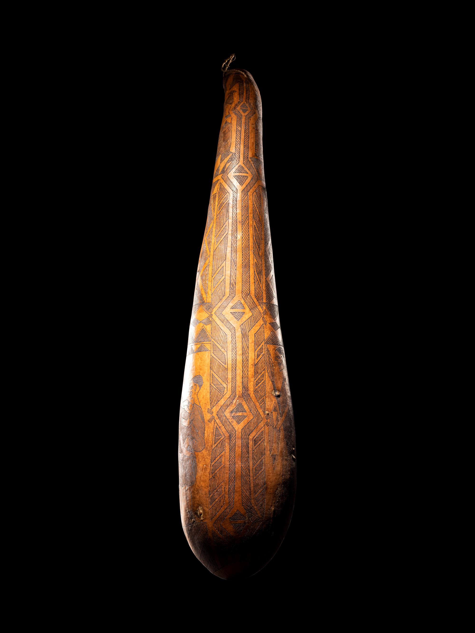 A Maasai Painted Hide Shield and Milk Gourd