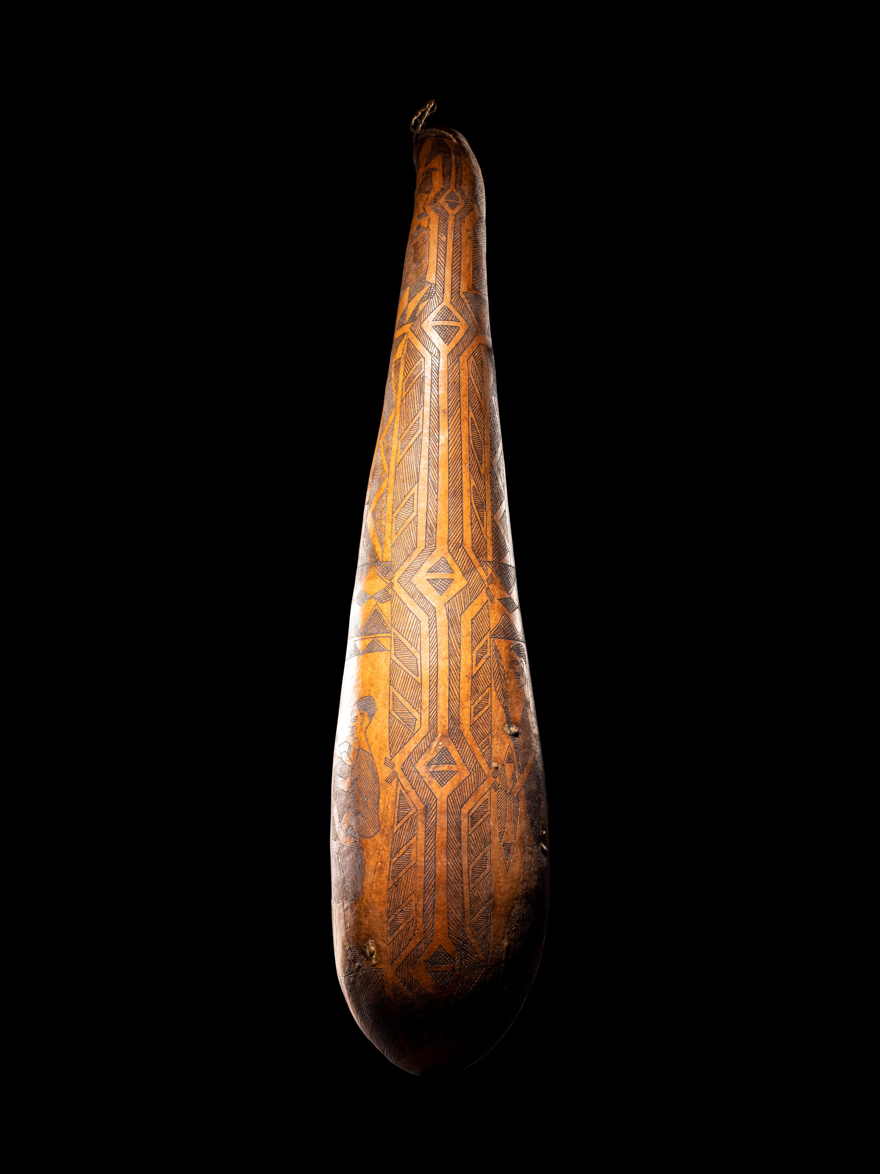 A Maasai Painted Hide Shield and Milk Gourd