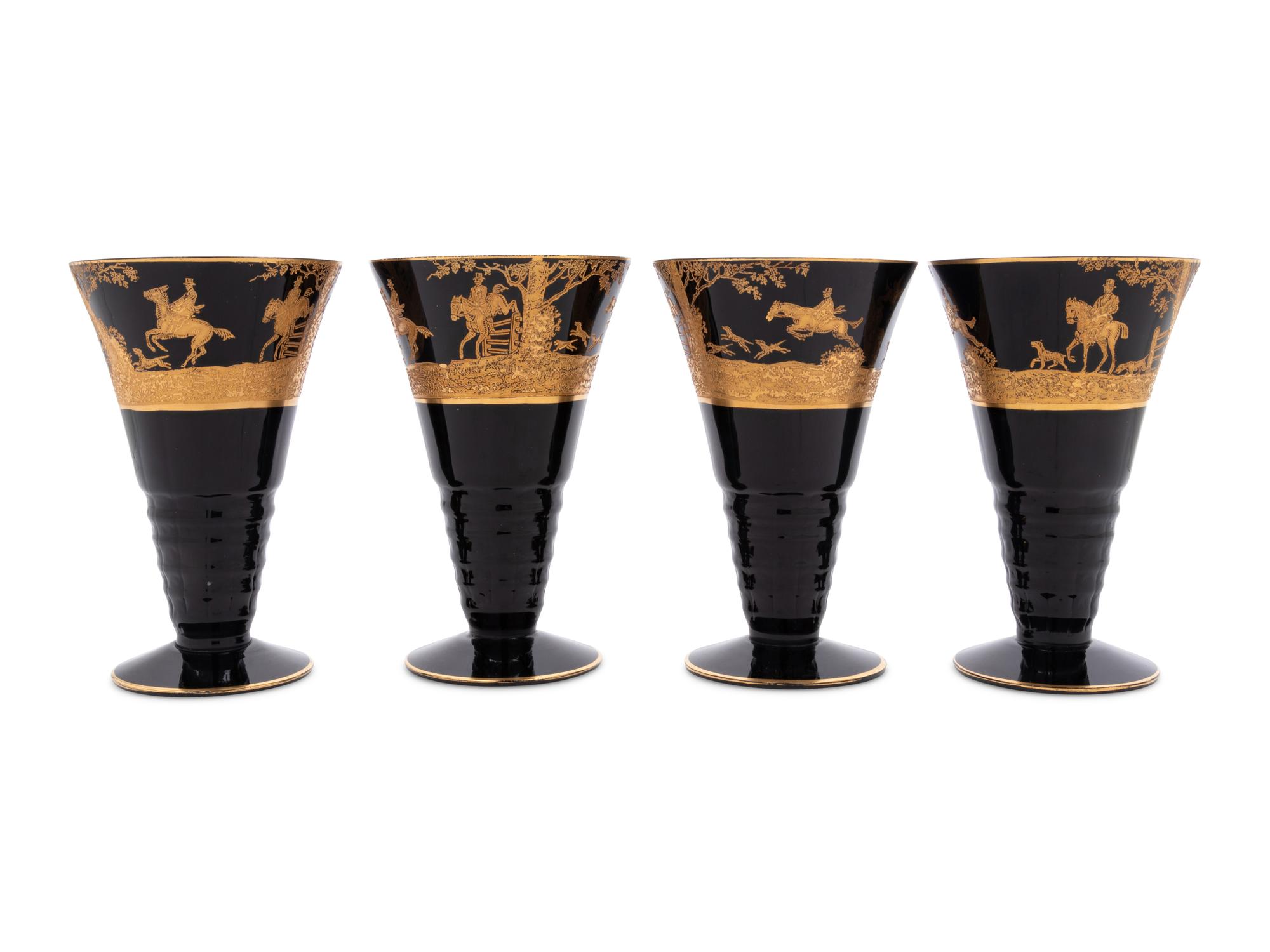 Four Continental Gilt Decorated Dark Amethyst Glass Goblets Depicting Hunting Scenes
