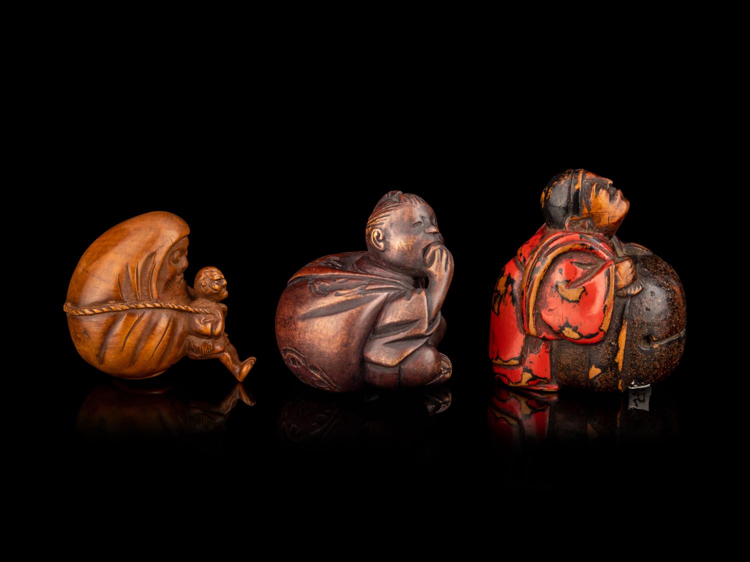 Three Japanese Carved Boxwood Figural-Form Netsuke