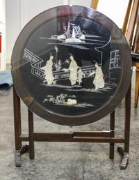 A Chinese Style Gate-Leg Table. Height 20 x diameter of top 24 inches.