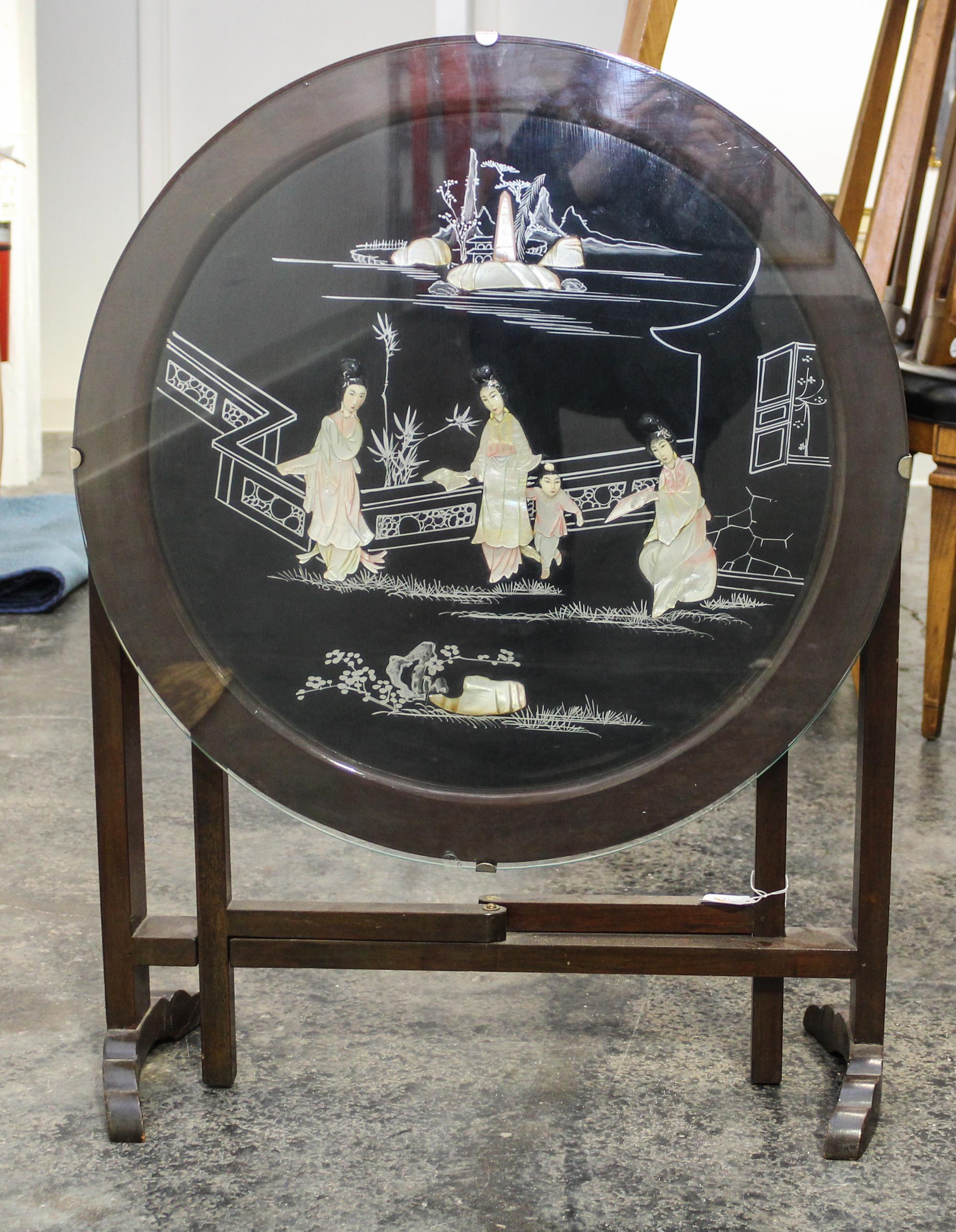 A Chinese Style Gate-Leg Table. Height 20 x diameter of top 24 inches.