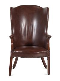 An English Leather Upholstered Mahogany Wingback Armchair