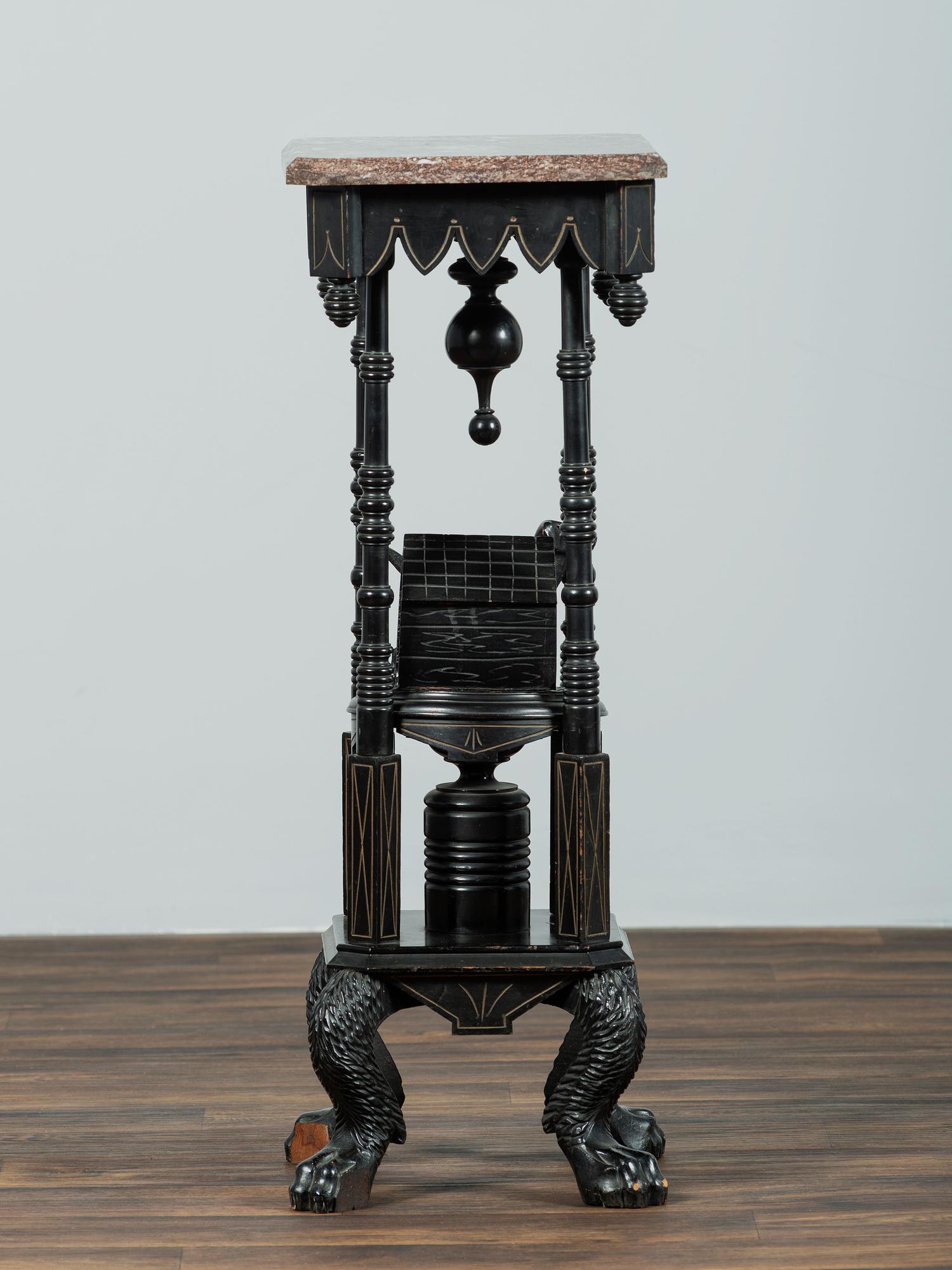 A Victorian Marble-Top Carved and Ebonized Parlor Table with Dog