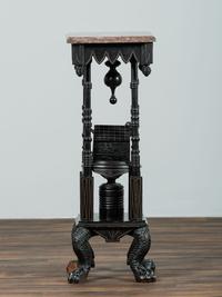 A Victorian Marble-Top Carved and Ebonized Parlor Table with Dog